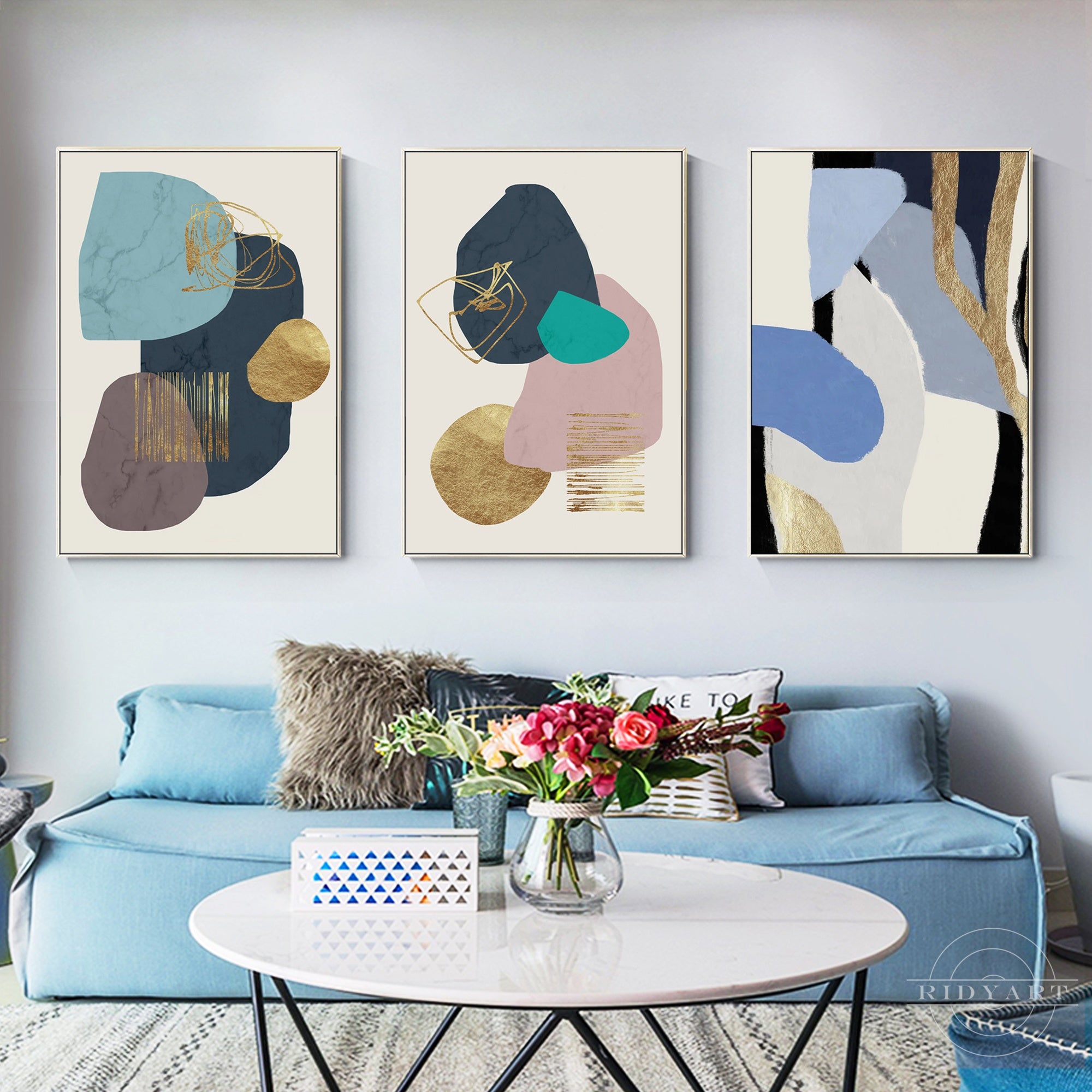 Geometric wall art in teal, stone, and gold tones