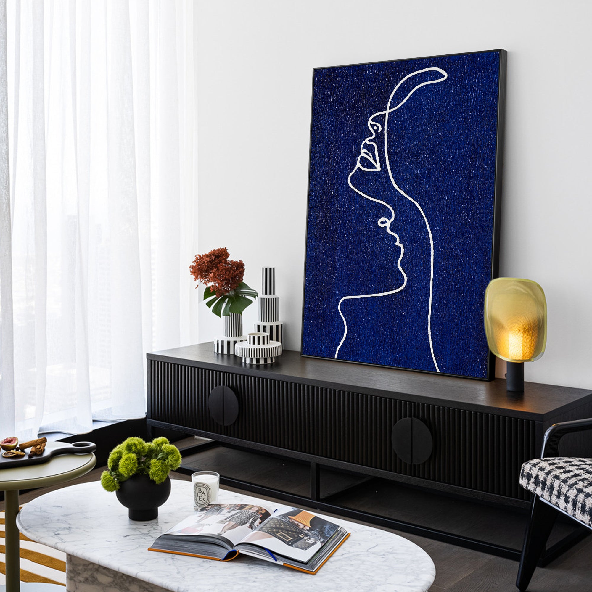 Picasso line art painting of a woman’s profile in navy blue on canvas, extra-large vertical framed wall art for minimalist and modern home decor.