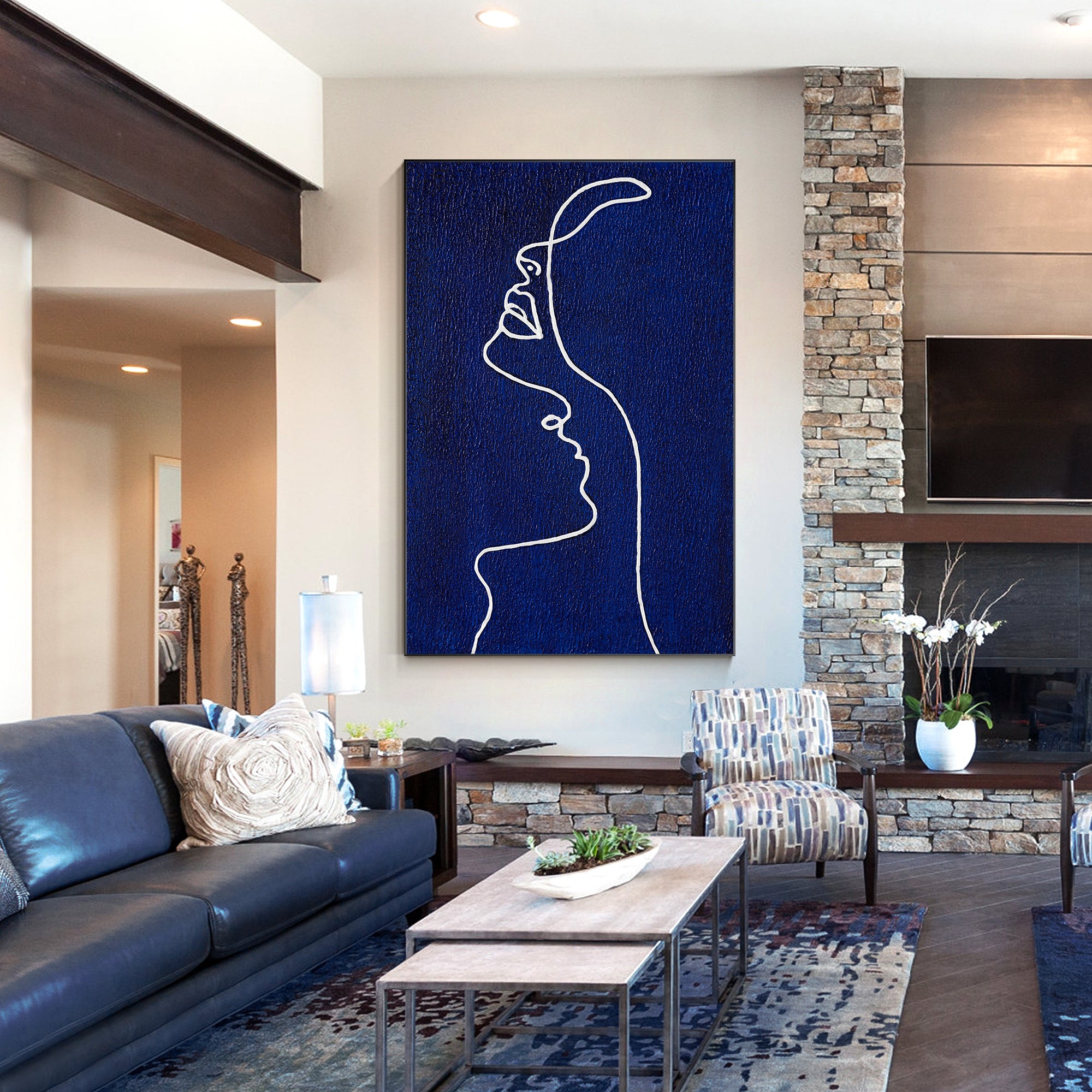 Picasso line art painting of a woman’s profile in navy blue on canvas, extra-large vertical framed wall art for minimalist and modern home decor.