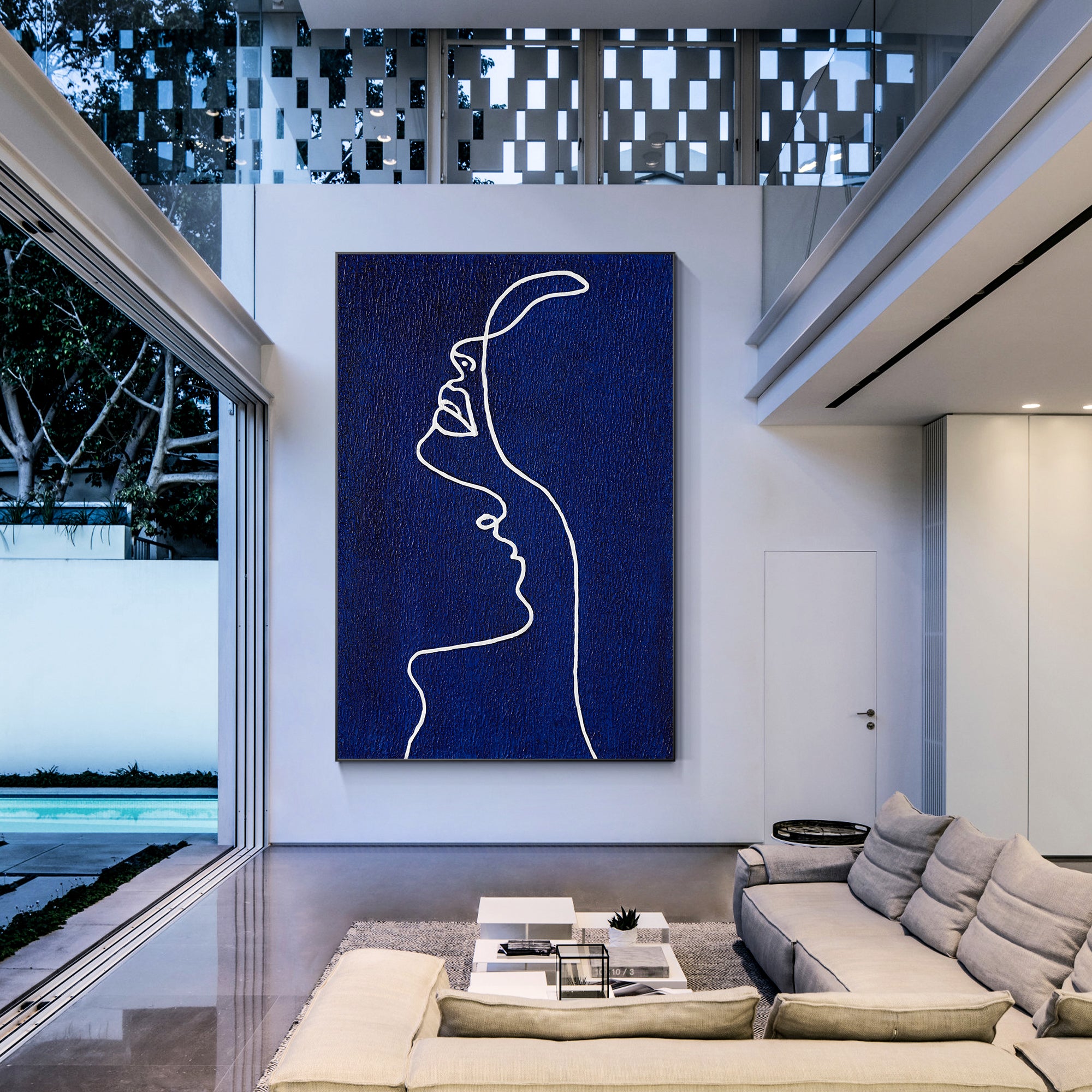 Picasso line art painting of a woman’s profile in navy blue on canvas, extra-large vertical framed wall art for minimalist and modern home decor.