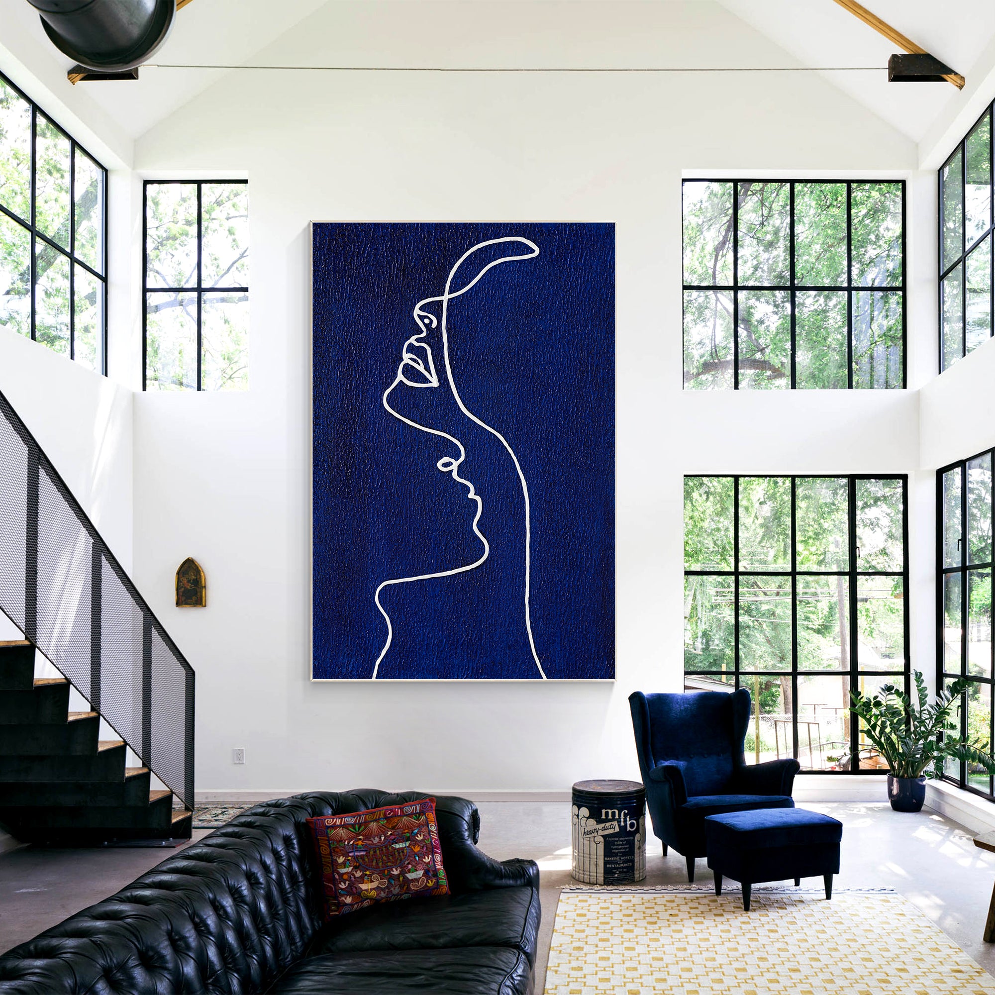 Picasso line art painting of a woman’s profile in navy blue on canvas, extra-large vertical framed wall art for minimalist and modern home decor.