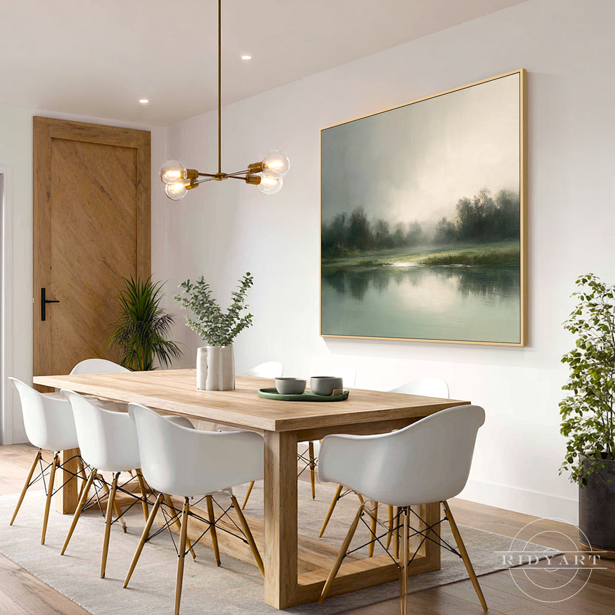 Soothing foggy green river canvas artwork providing a peaceful natural backdrop mounted above a wooden dining room table.