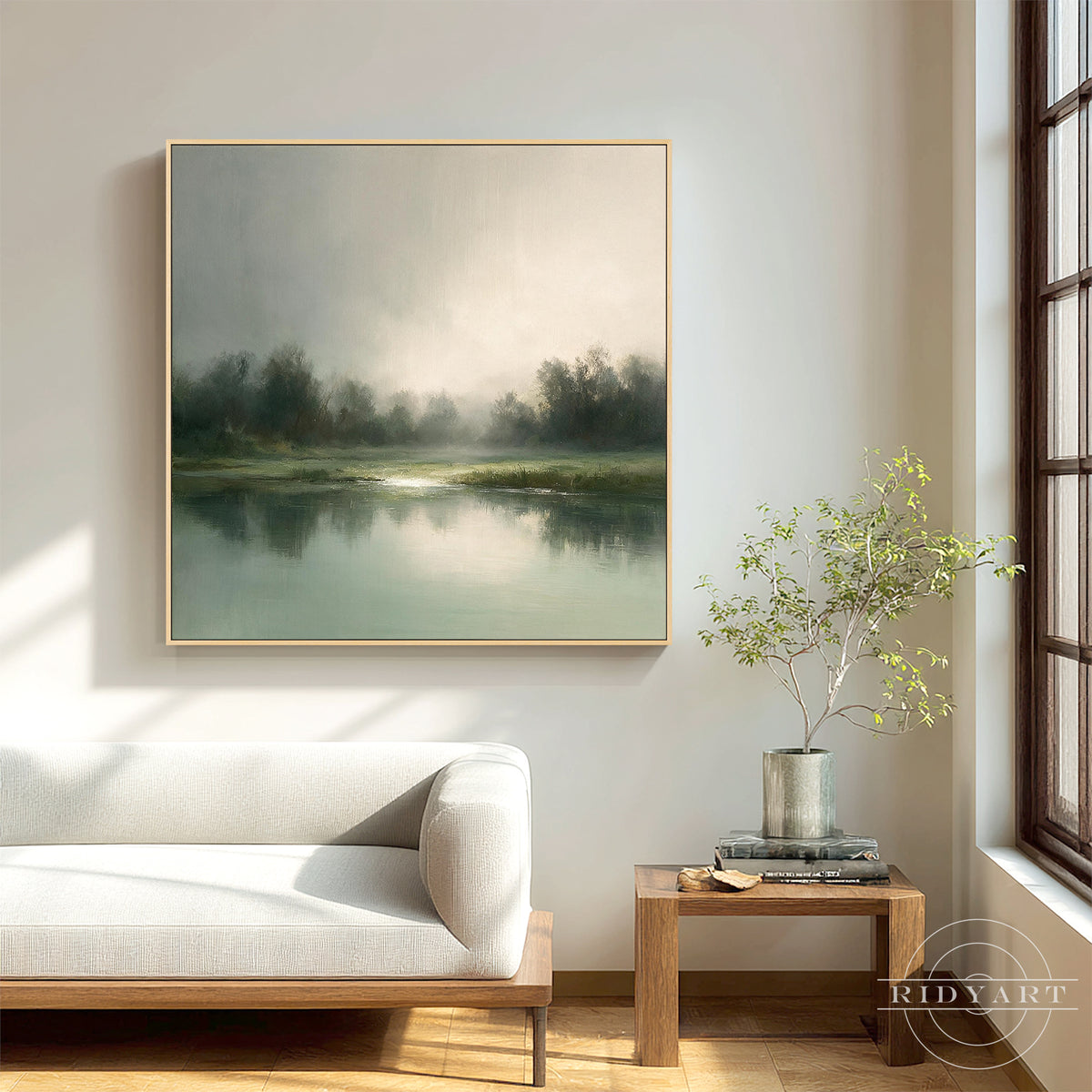 Calm hand painted misty tree landscape square canvas painting mounted above an upholstered bed frame in a tranquil bedroom space.