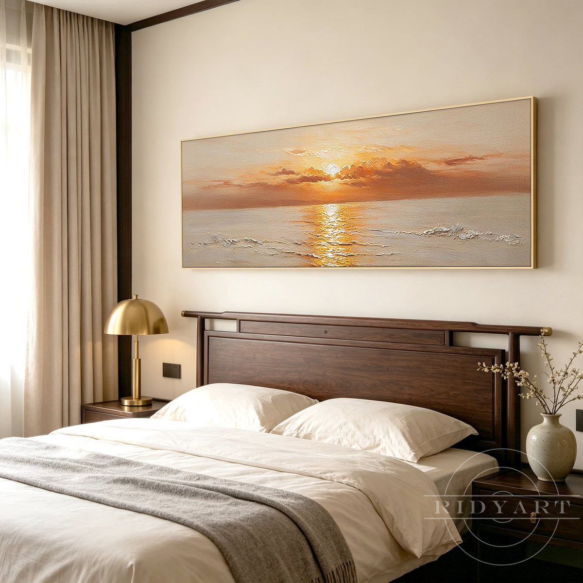 Wide panoramic golden sunset ocean canvas art mounted above a sofa in a contemporary living room.