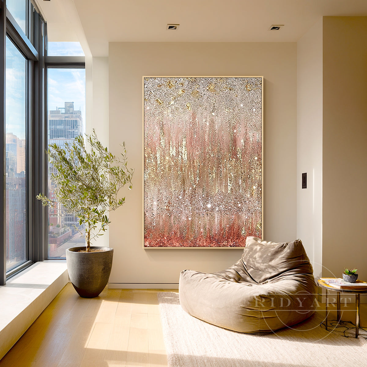 Shimmering blush pink and champagne gold wall painting above a sofa.
