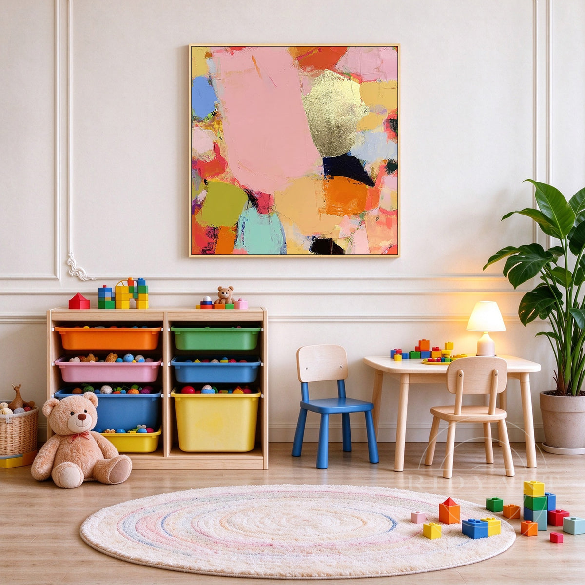 Framed square colorful abstract canvas art with metallic gold accents displayed on a neutral living room feature wall.