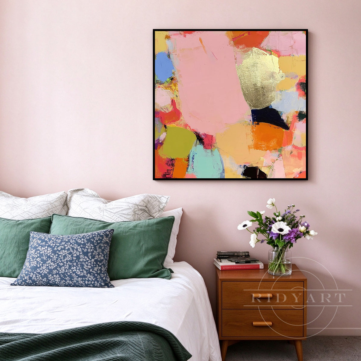 Vibrant pink and gold leaf hand-painted abstract canvas artwork with gold frame mounted above a bed frame for modern bedroom decor.