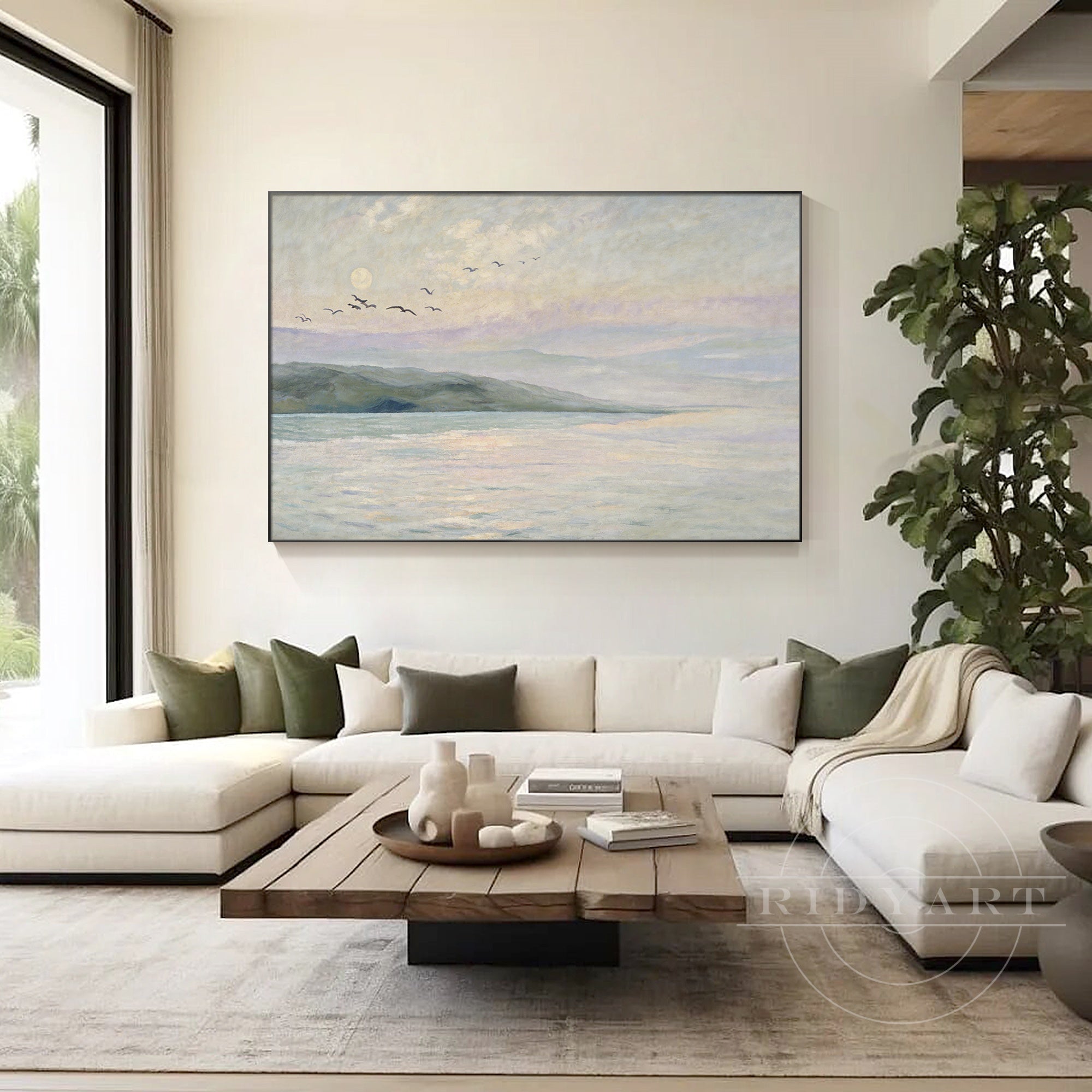 Coastal landscape wall art above living room sofa