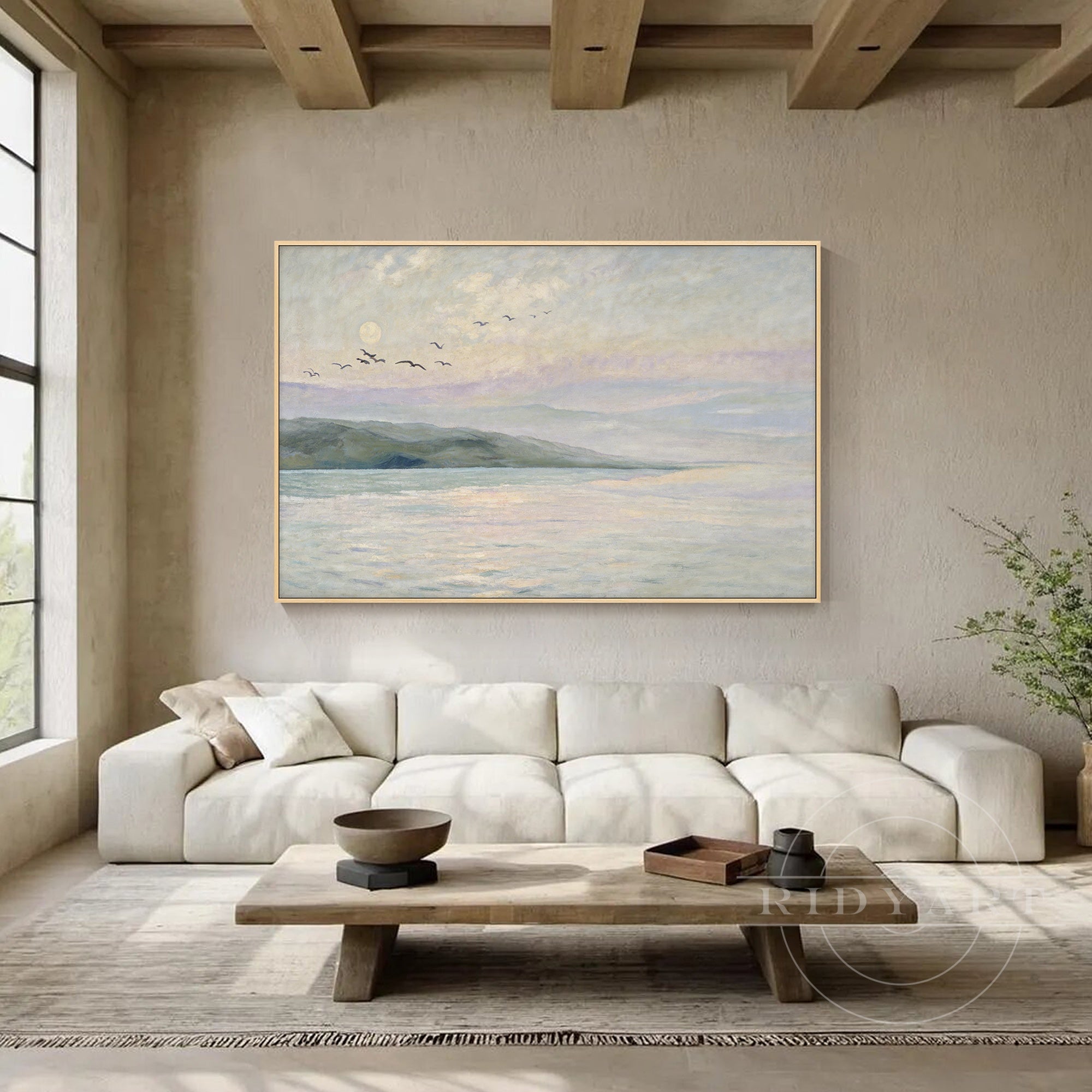 Neutral seascape wall art in dining room