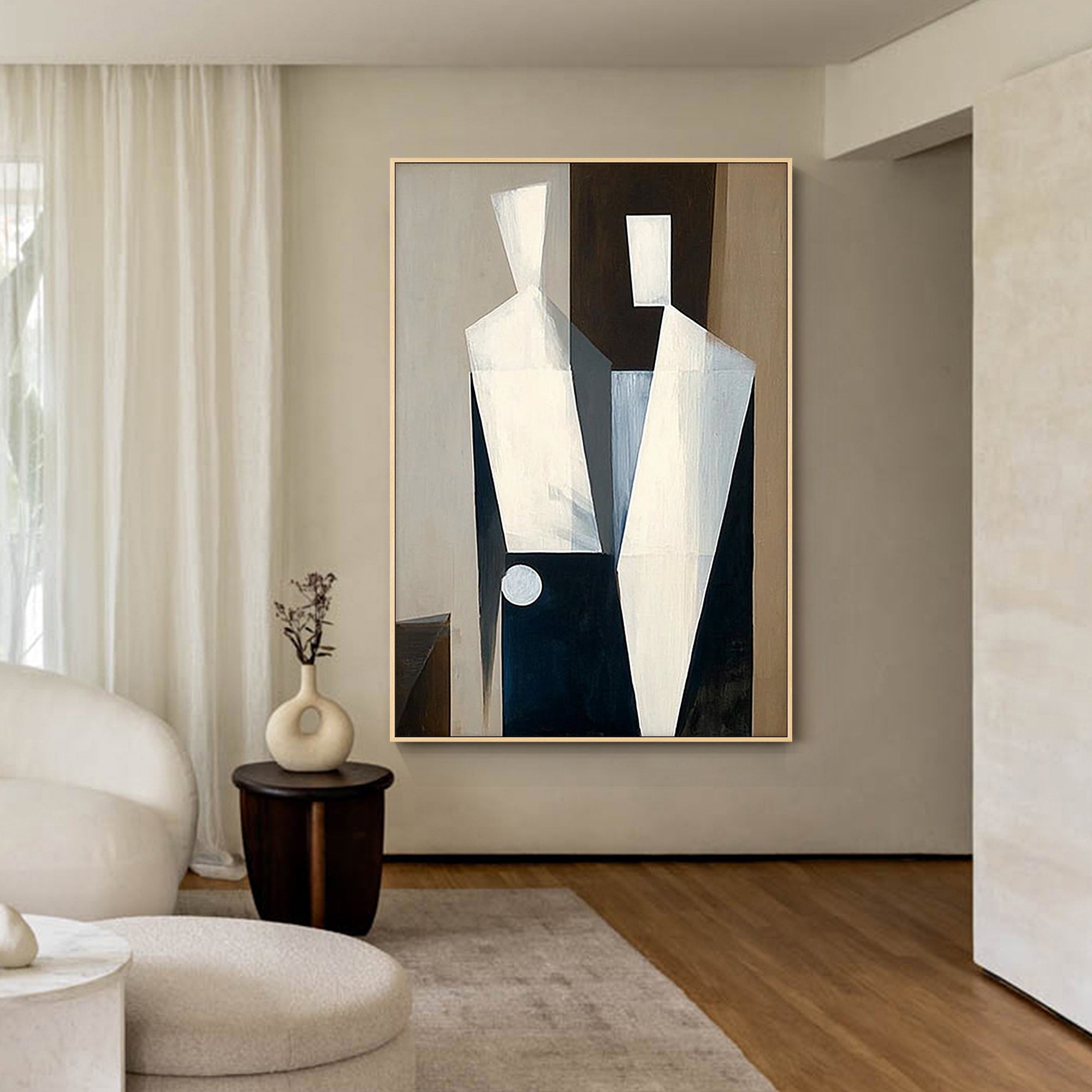 large neutral abstract painting above bed in modern bedroom