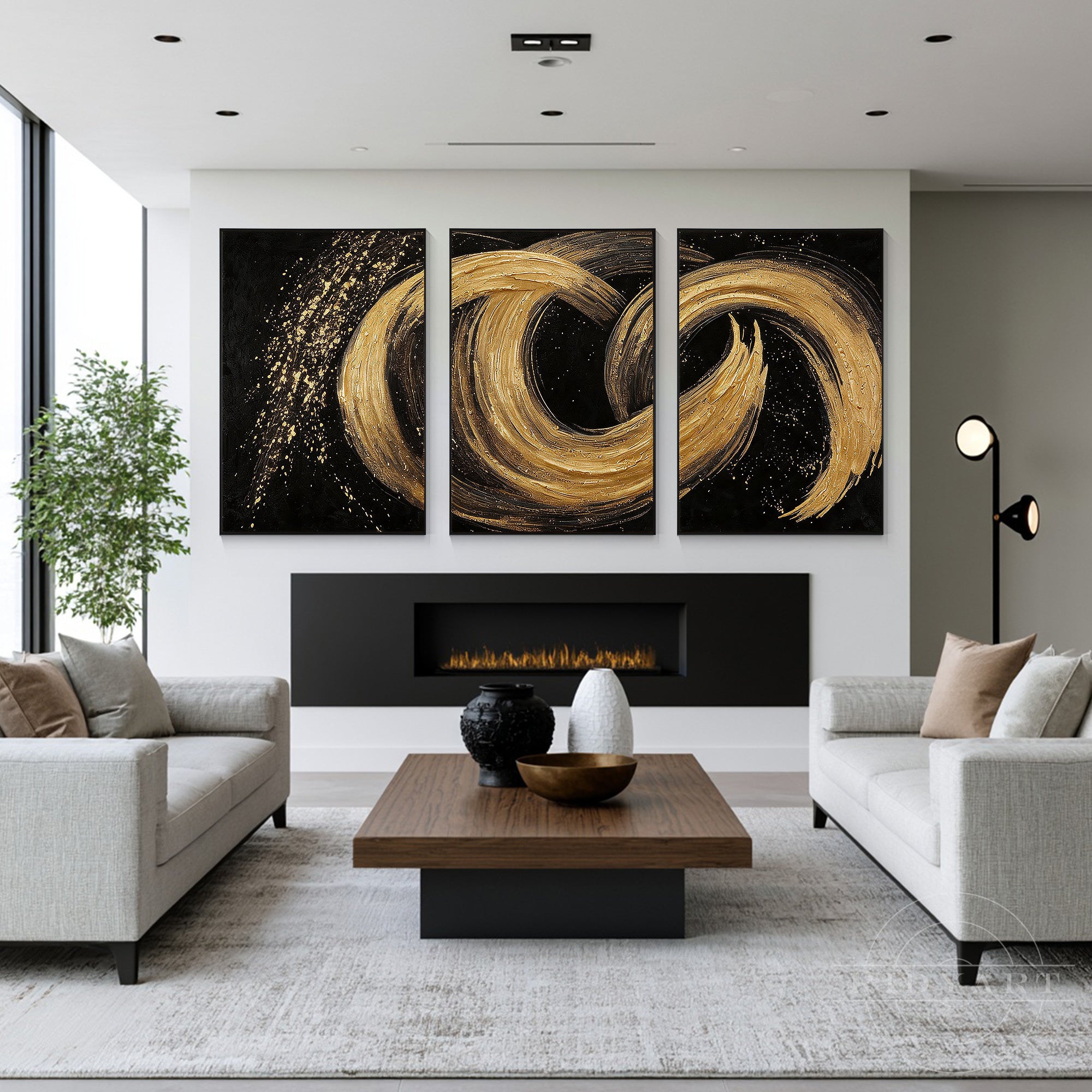 Modern black and gold heavy texture 3-piece abstract canvas art hanging above a linear fireplace in a contemporary open-concept lounge.