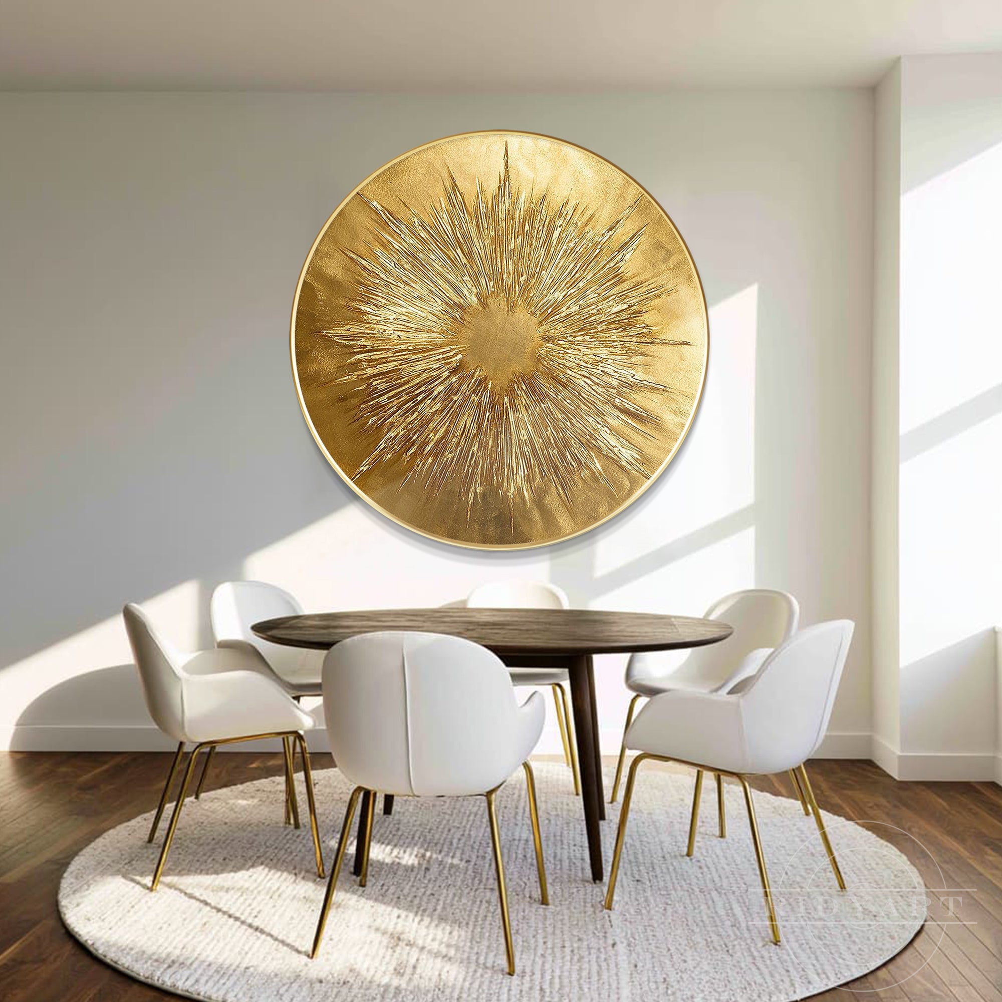 Large round gold abstract canvas painting featured in a bright dining room above a dark wood table with white upholstered chairs.