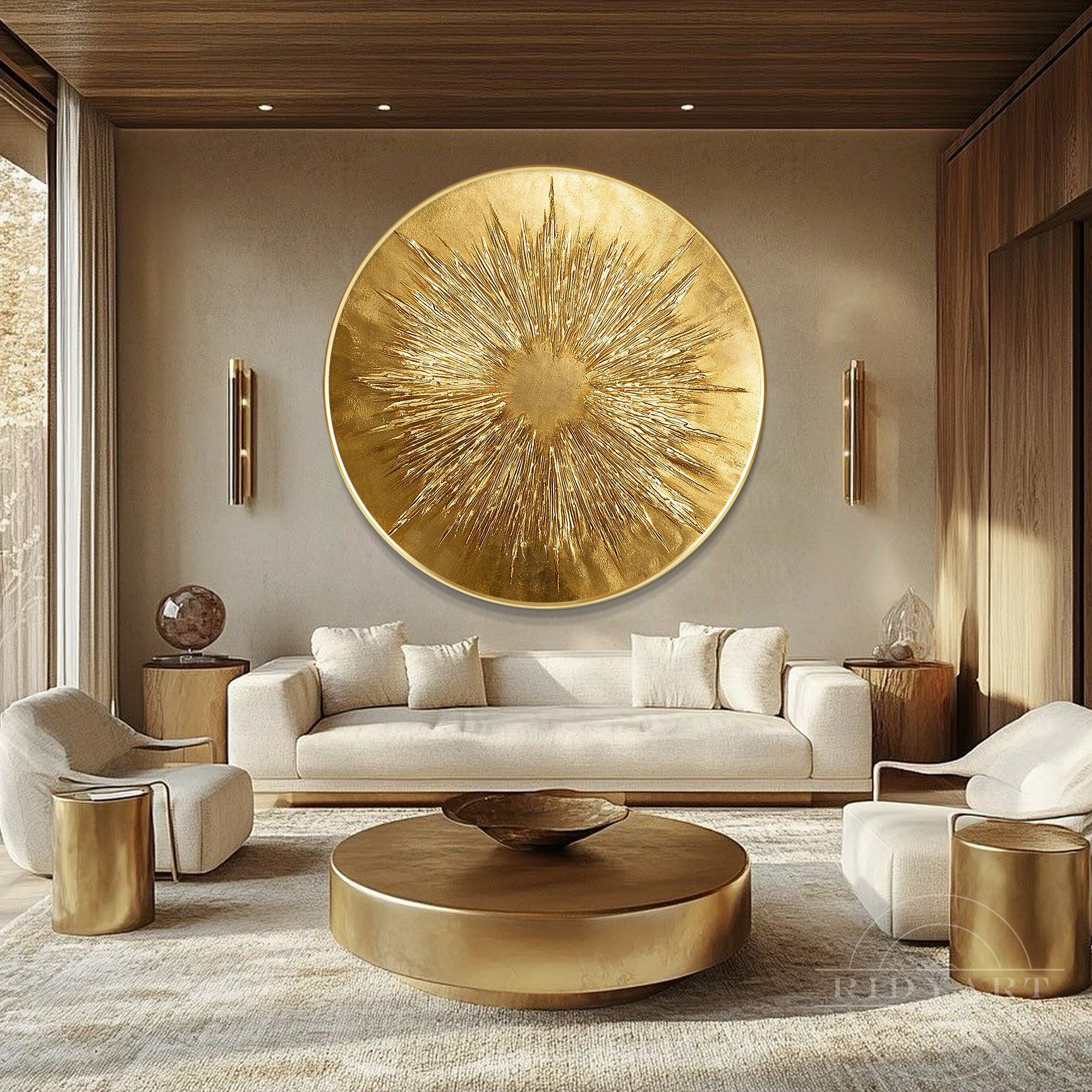 Large circular gold sunburst canvas artwork hanging above a cream sofa in a modern minimalist living room with warm wood accents.