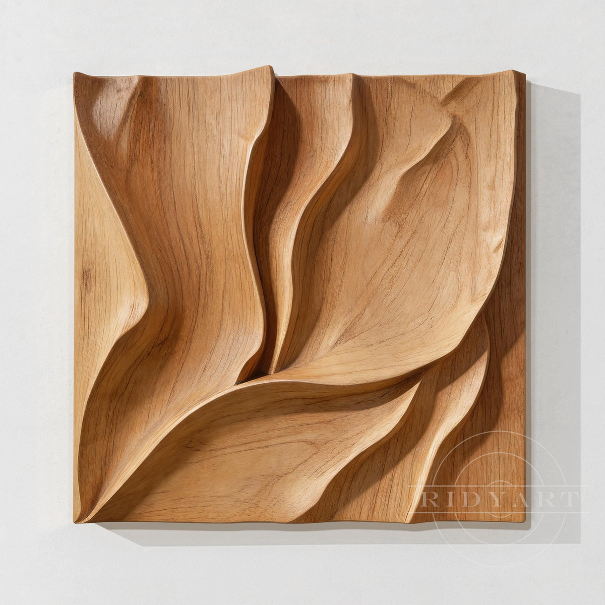 Panoramic abstract organic carved wood wall art above a console