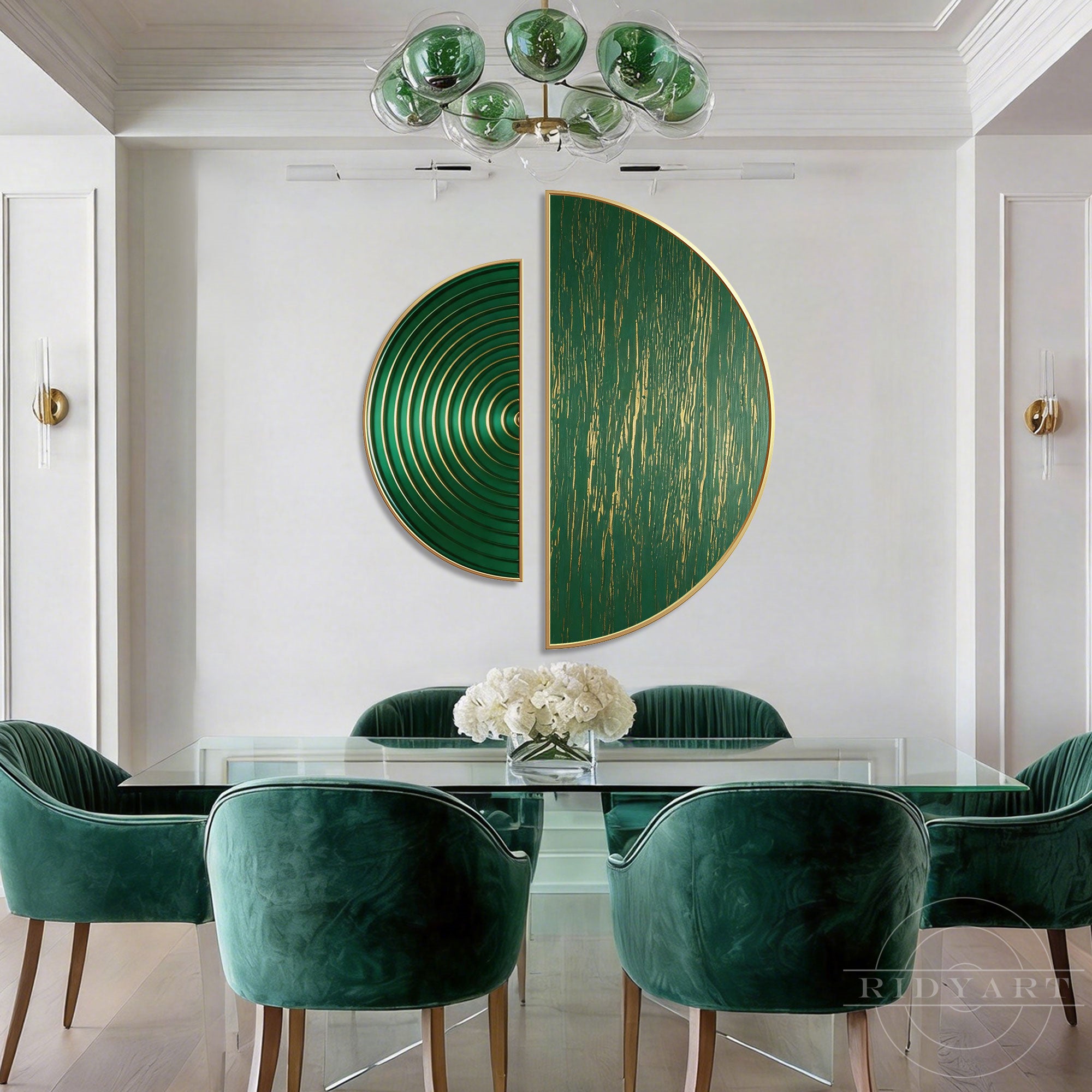 This set of 2 half round circle paintings features exquisite gold and green textured abstract art above a sleek glass table and plush green velvet chairs.