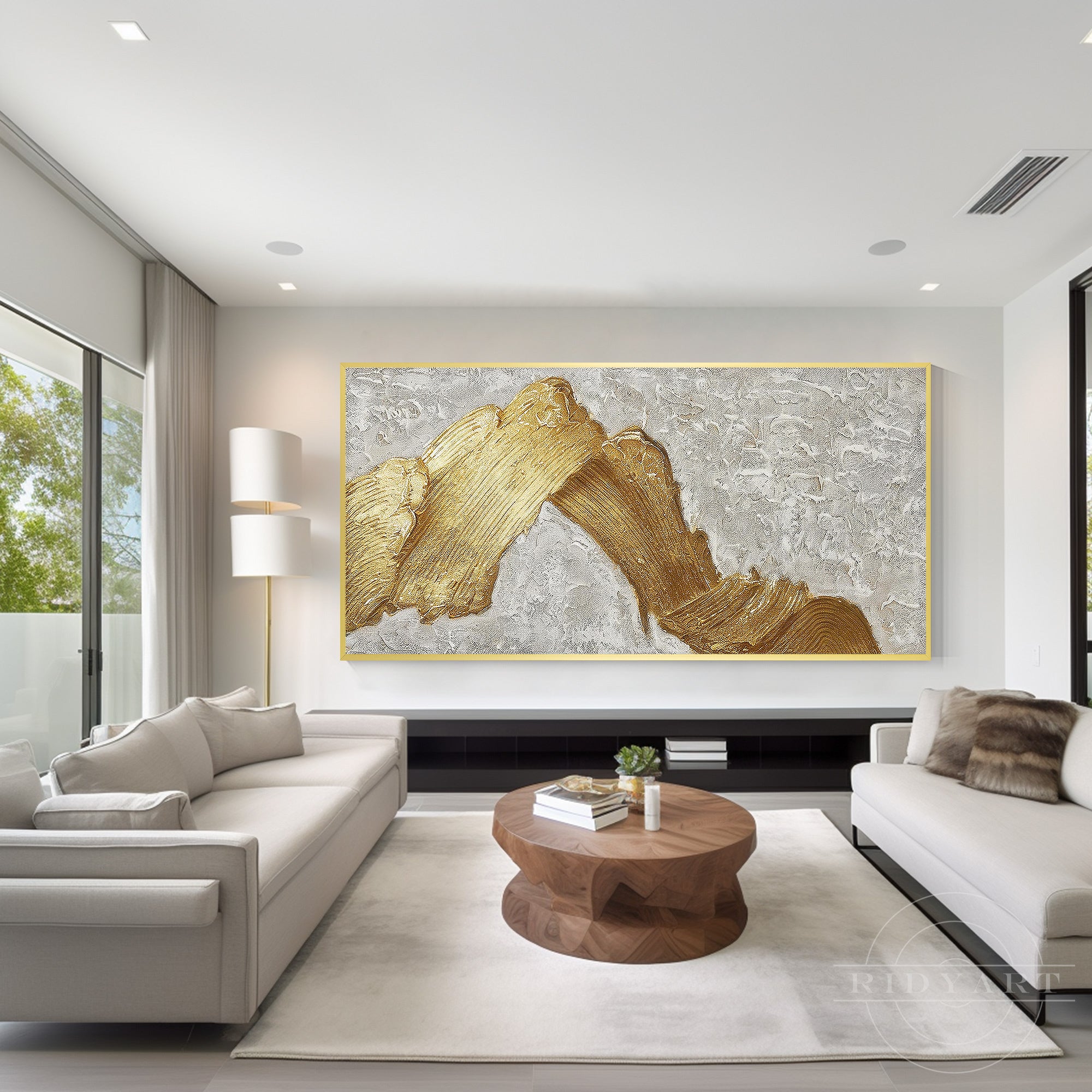 Oversized gold abstract wall art above a low TV stand in a modern minimalist living room.