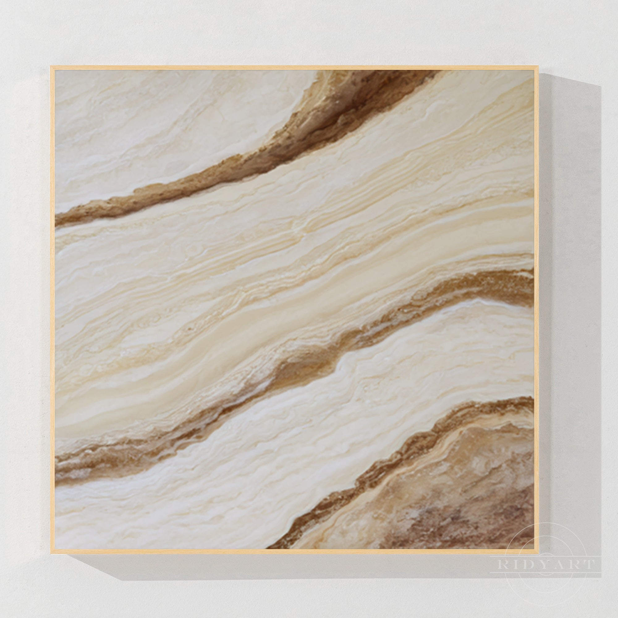 Minimalist abstract square canvas art featuring bright ivory, beige, and warm gold marble texture with wood frame.