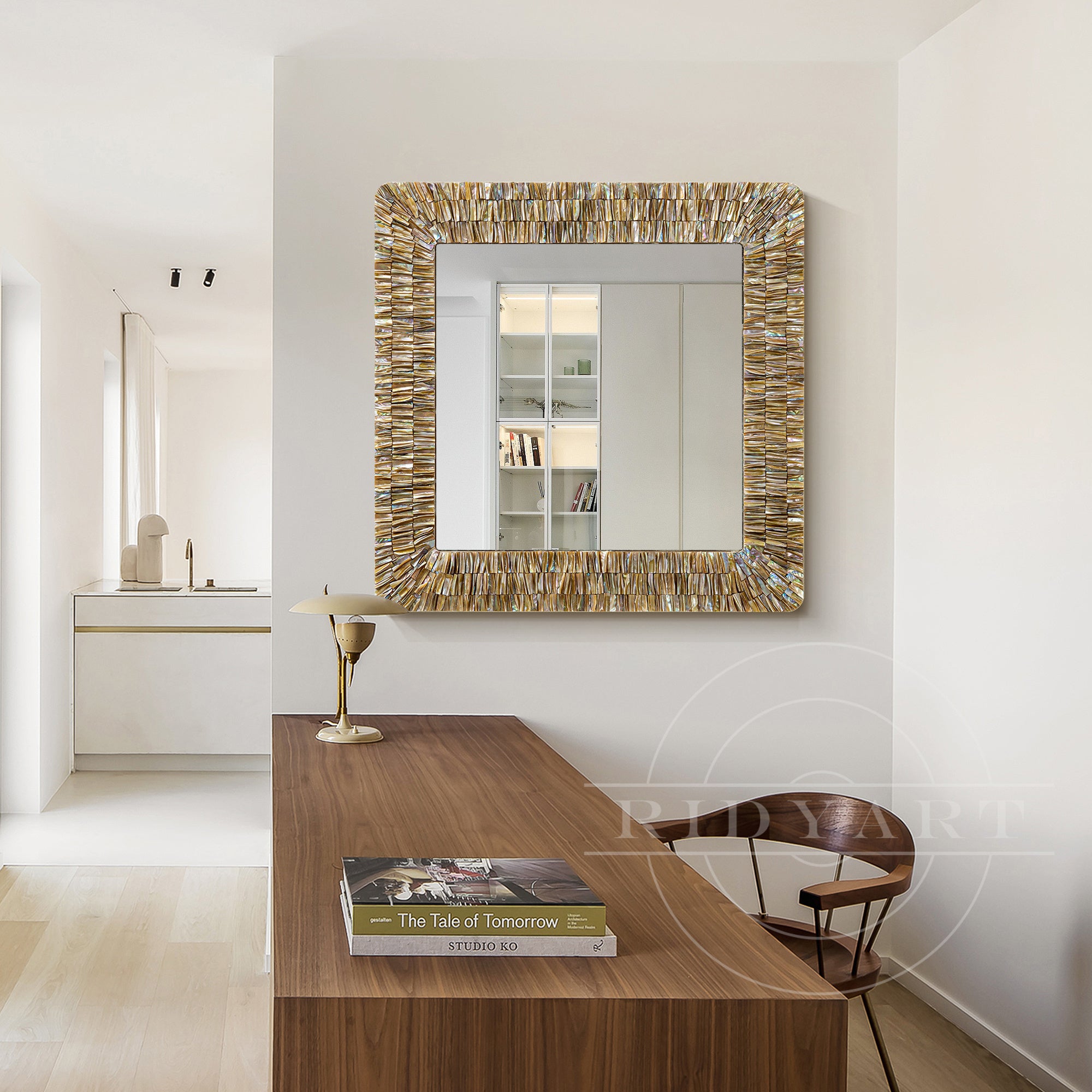 Coastal-themed mirror with hand-arranged shell decorations for wall art