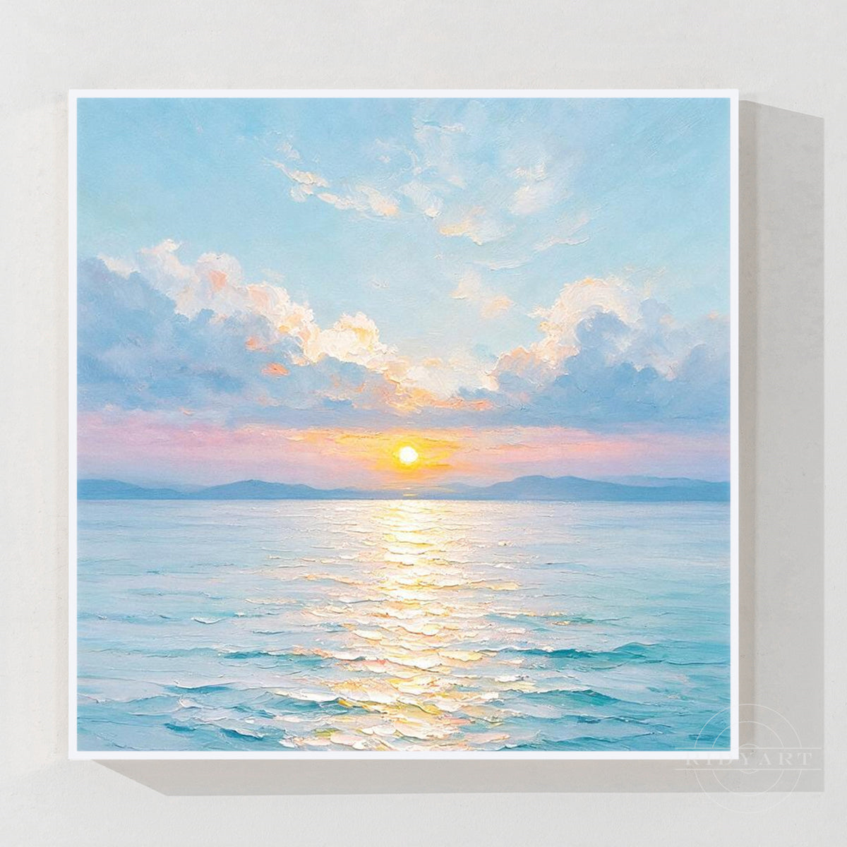 Blue ocean sunset wall art with a glowing golden sun, soft pink clouds, and textured waves.