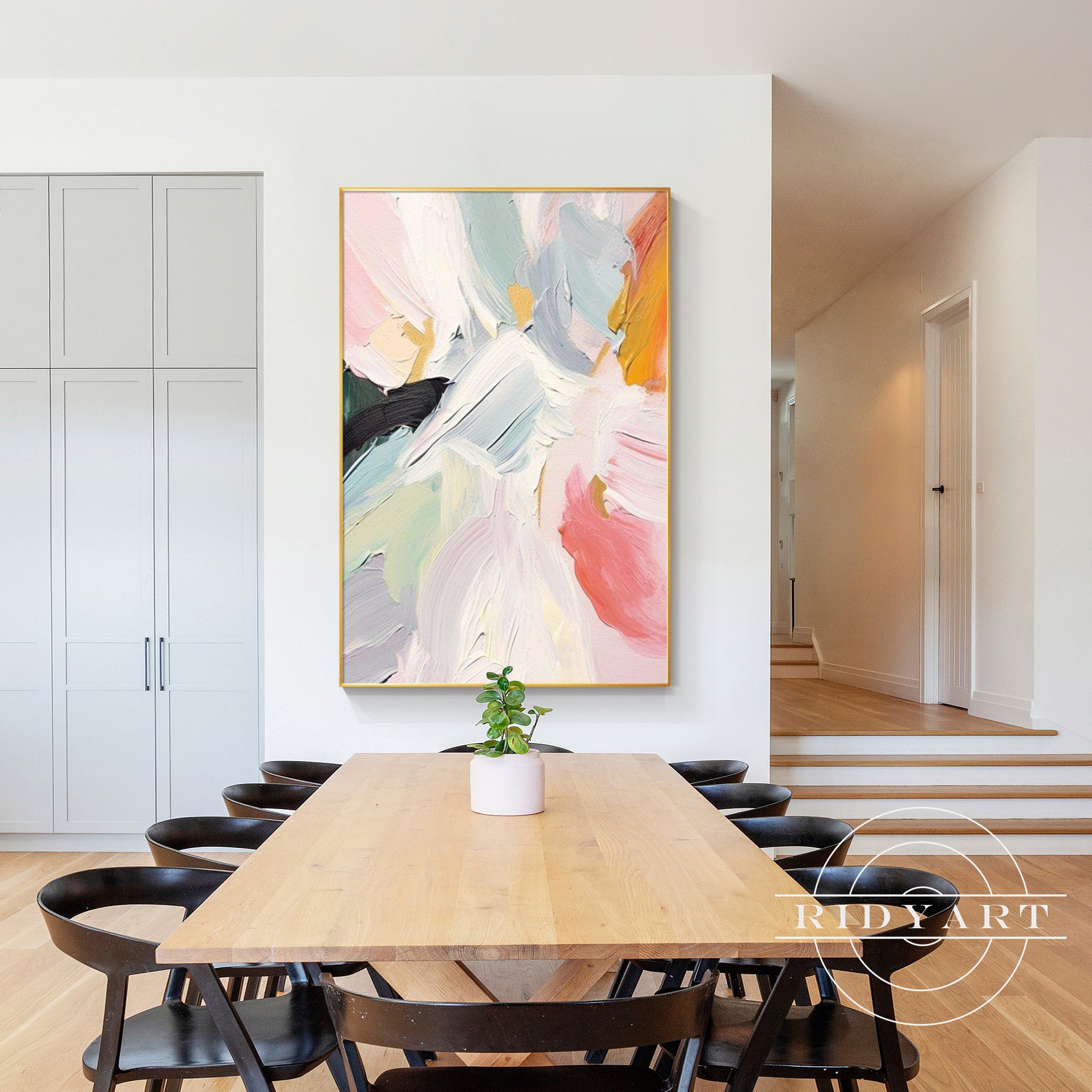 Large pastel abstract wall art with textured pink and gray design.