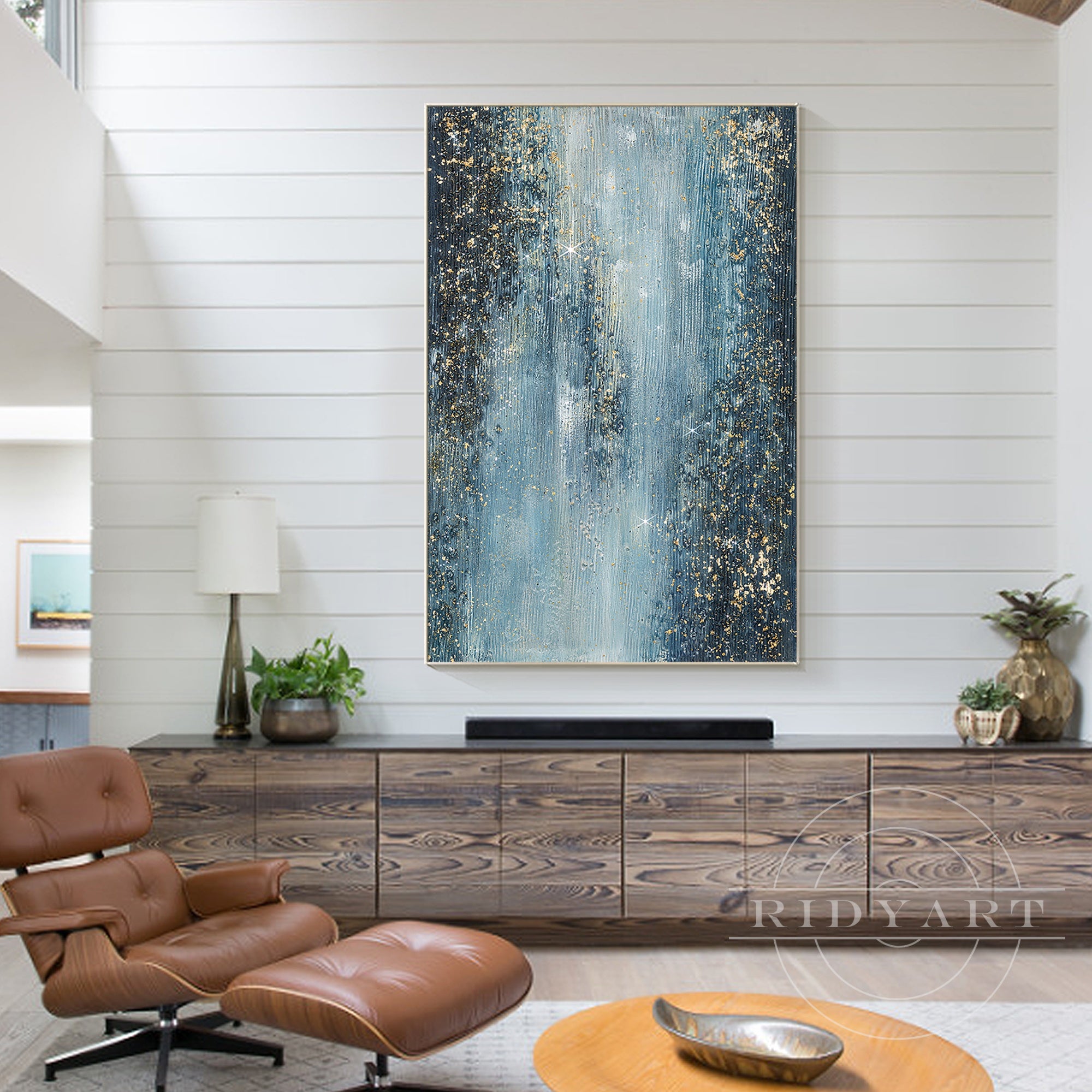 Textured abstract painting featuring navy blue and gold glitter.