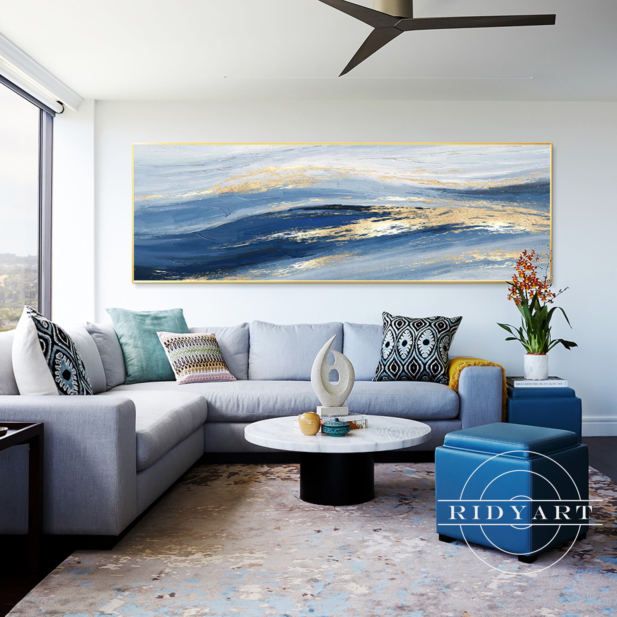 Long horizontal abstract painting with navy and gold tones