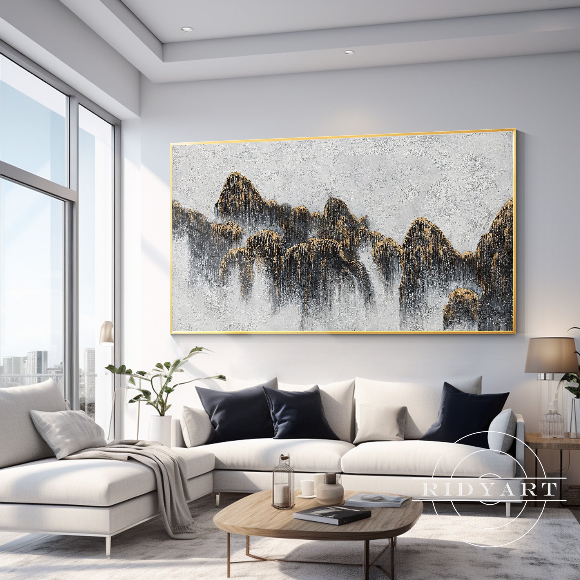 Large framed mountain artwork in black and gold tones