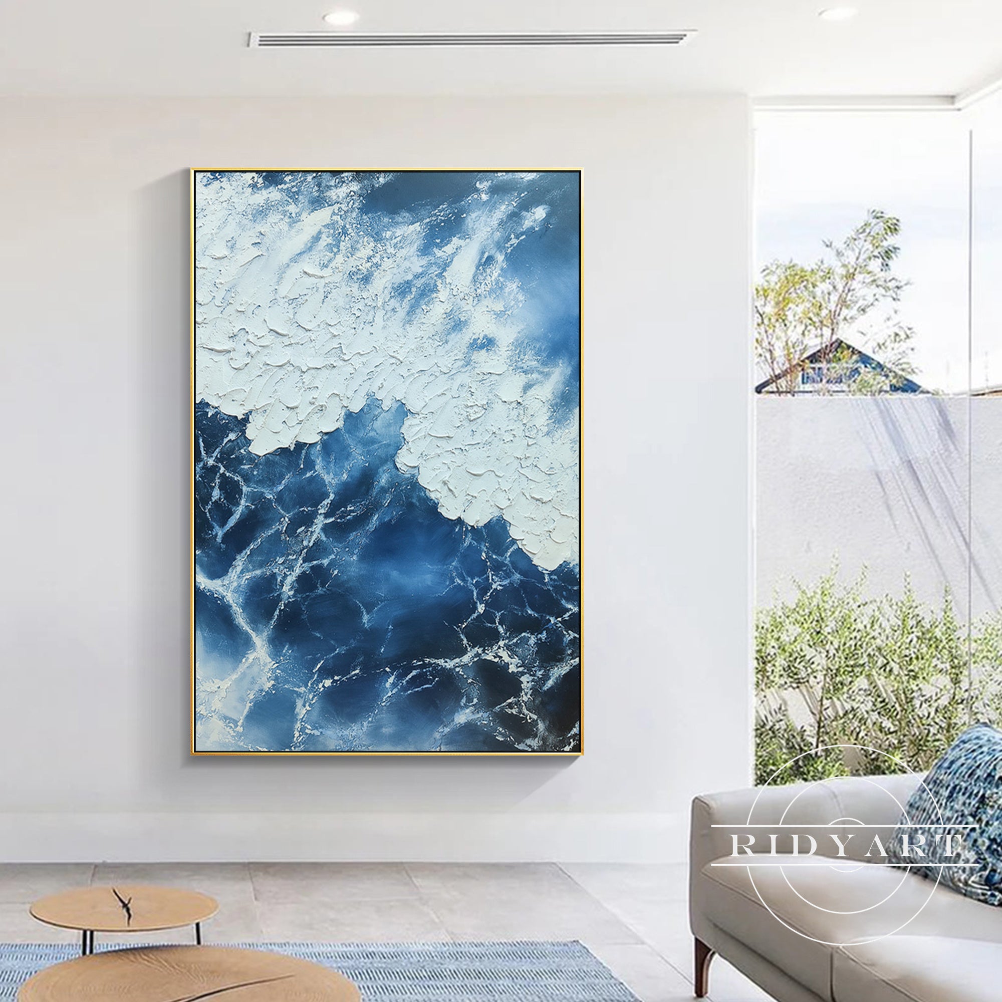 Abstract navy blue ocean painting with white textured brushstrokes.