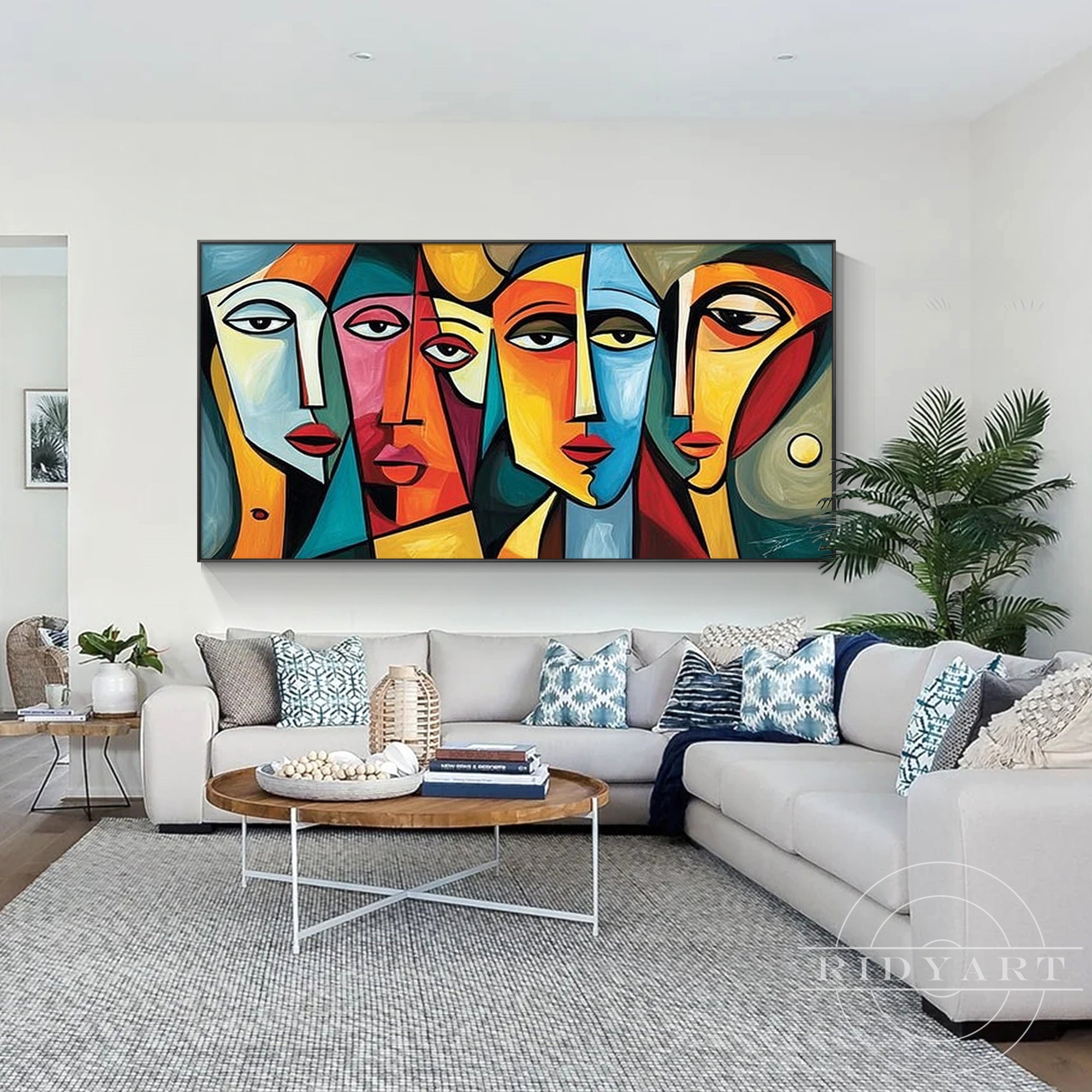 Modern cubist face painting on canvas with bold blue, yellow, orange, and red tones for living room.