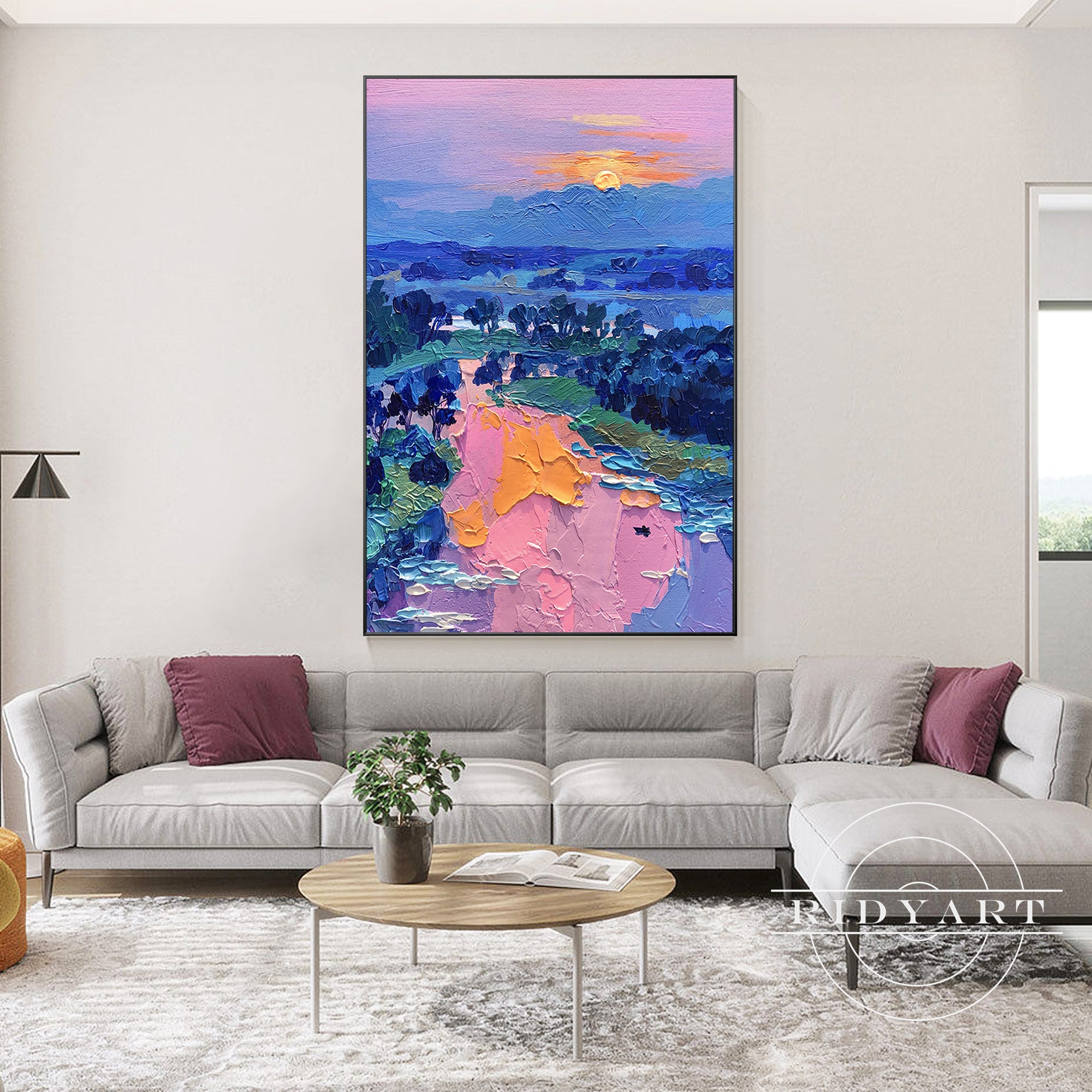 Textured mountain painting with sunrise and soft pastel colors.