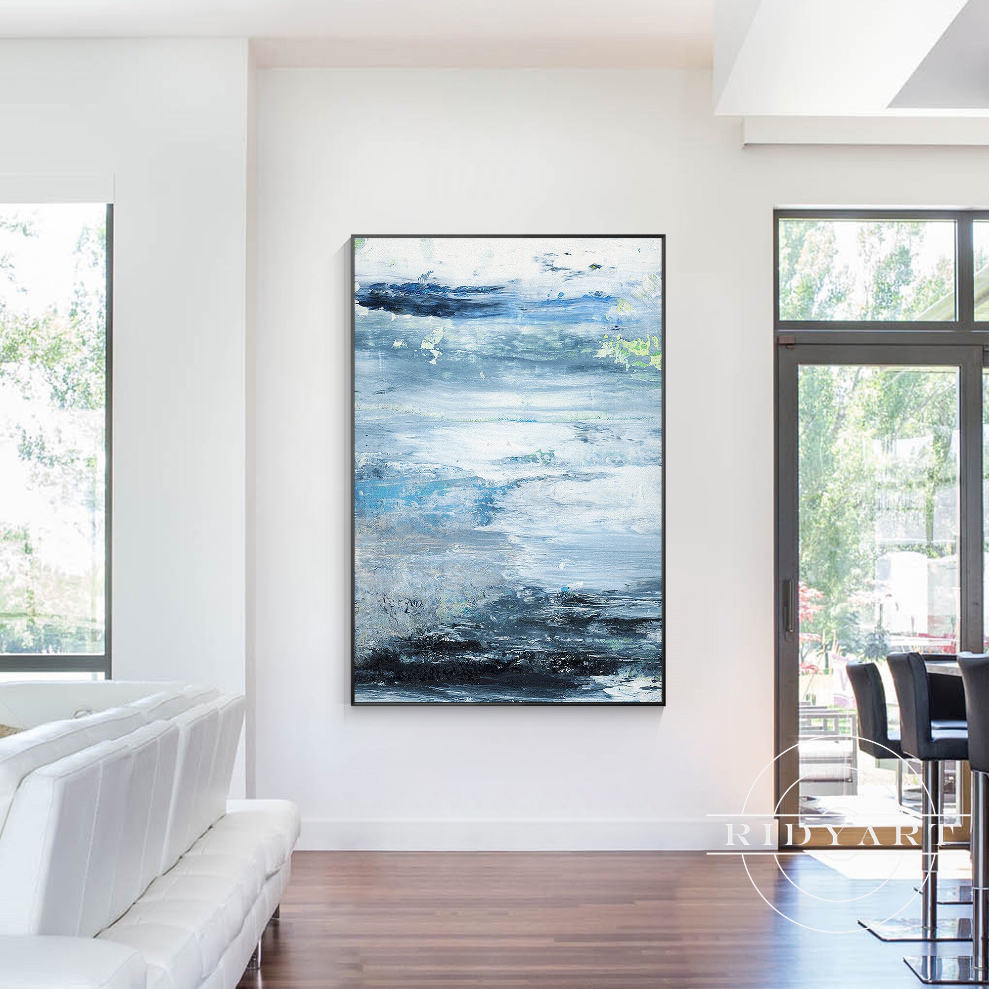 Modern coastal decor with blue abstract ocean canvas