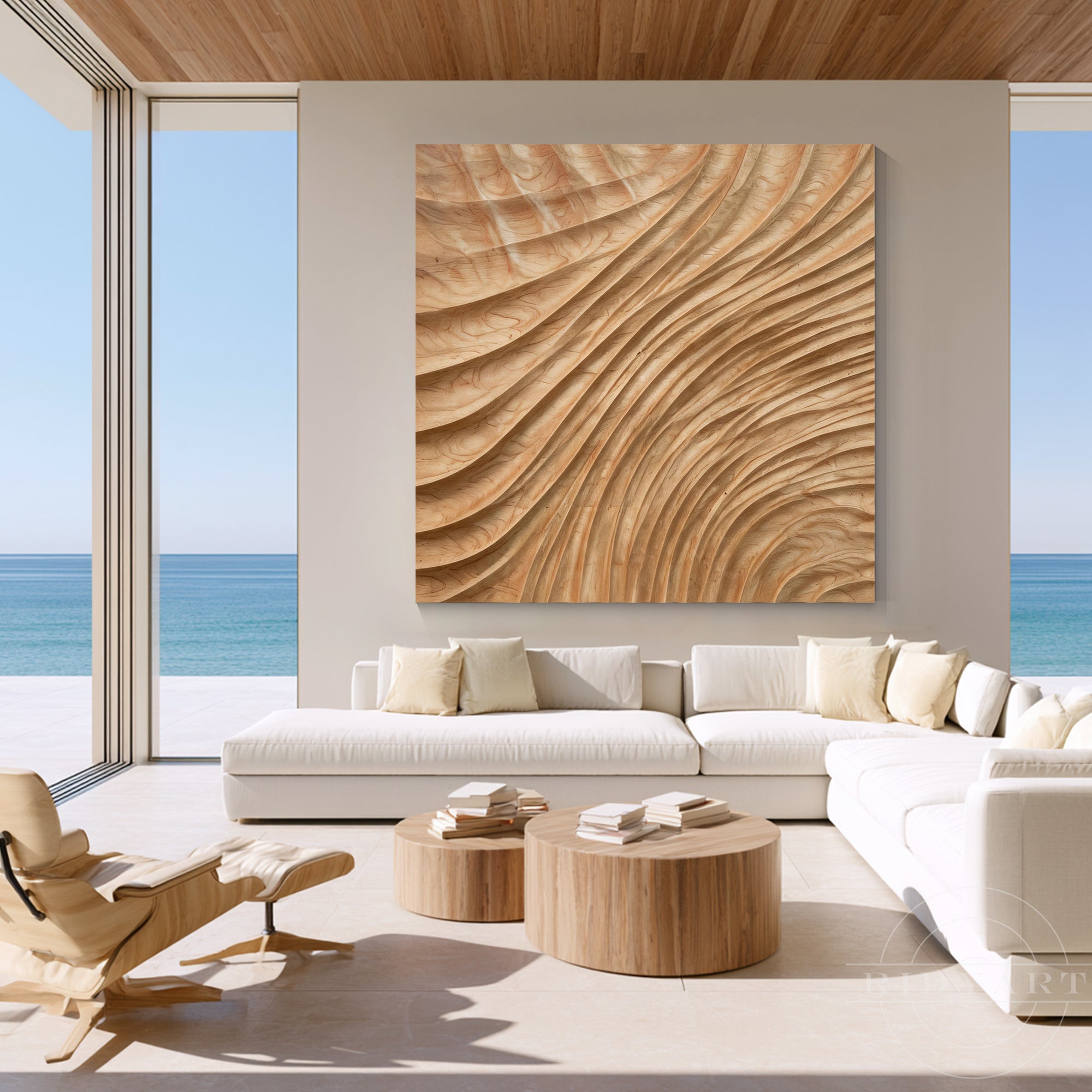 Large square wave carved wood wall art in a luxury oceanfront living room with white modular sofa and round coffee tables