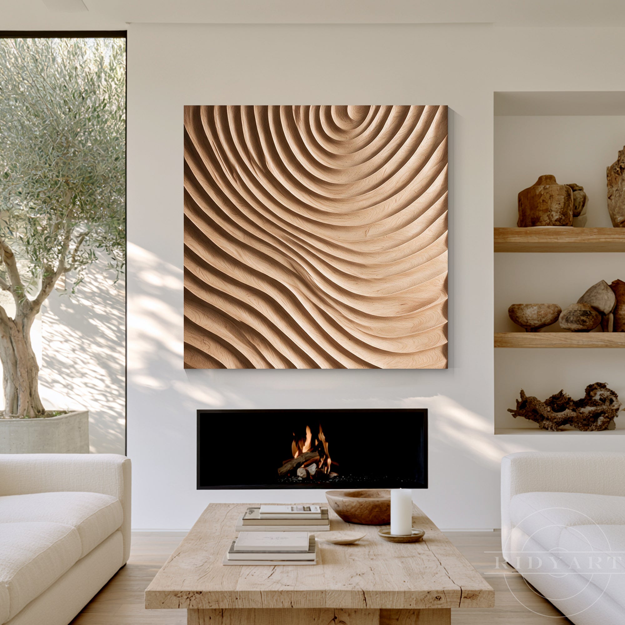 Square wood wall art painting mounted above a modern fireplace in a cozy neutral living room