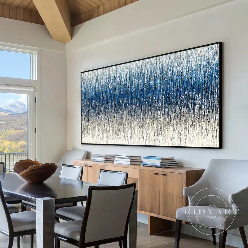 large abstract painting above sofa