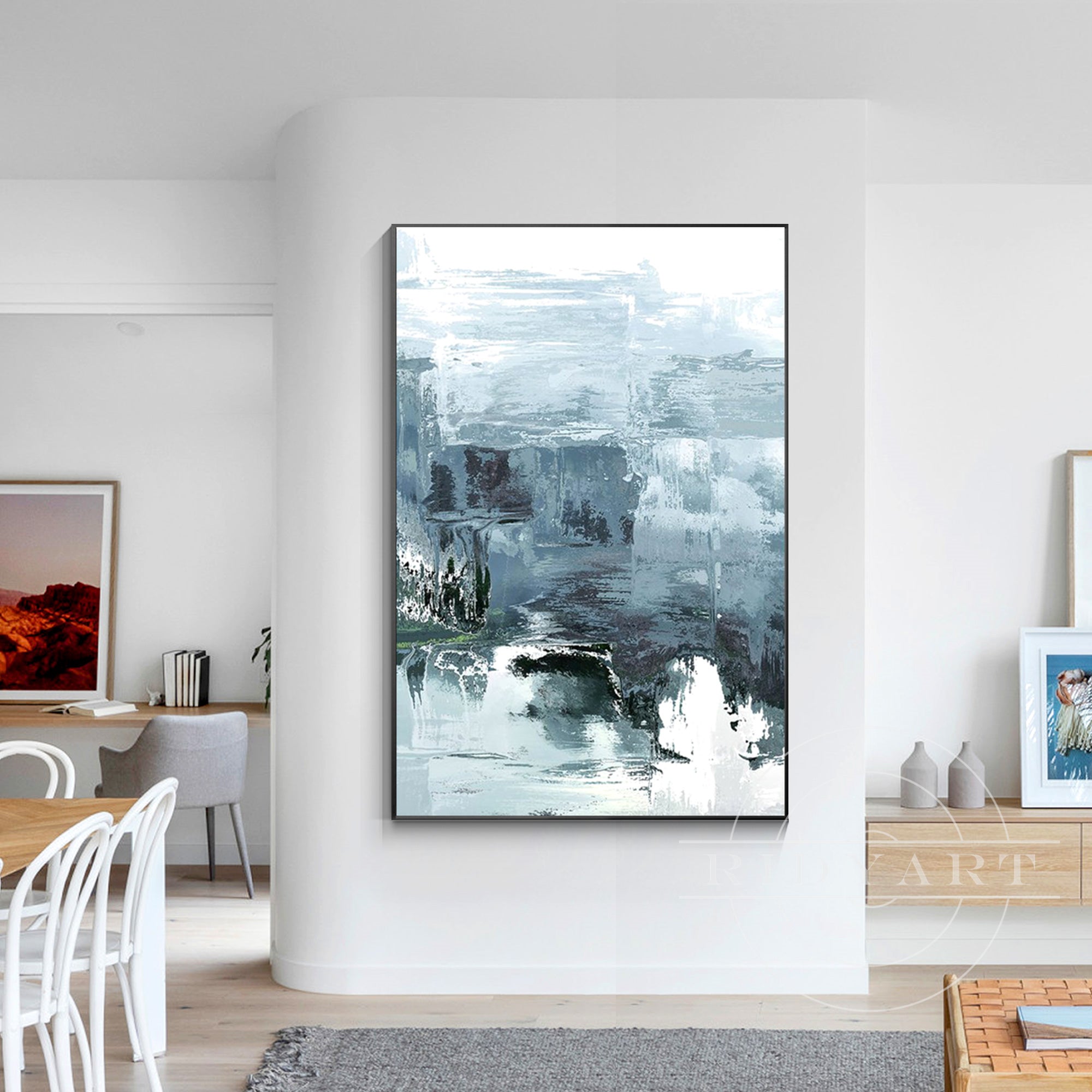 Abstract minimalist landscape painting in blue, gray, and white tones, large canvas wall art with textured palette knife strokes depicting water and sky in a serene, modern style.