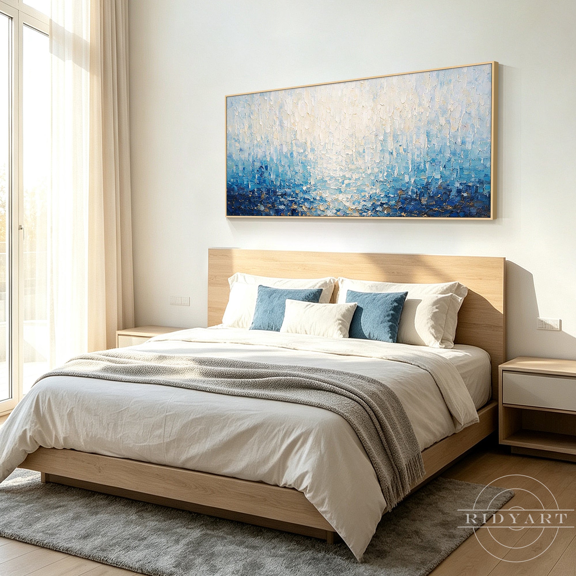 Large blue abstract wall art inspired by rain and ocean light, framed in white
