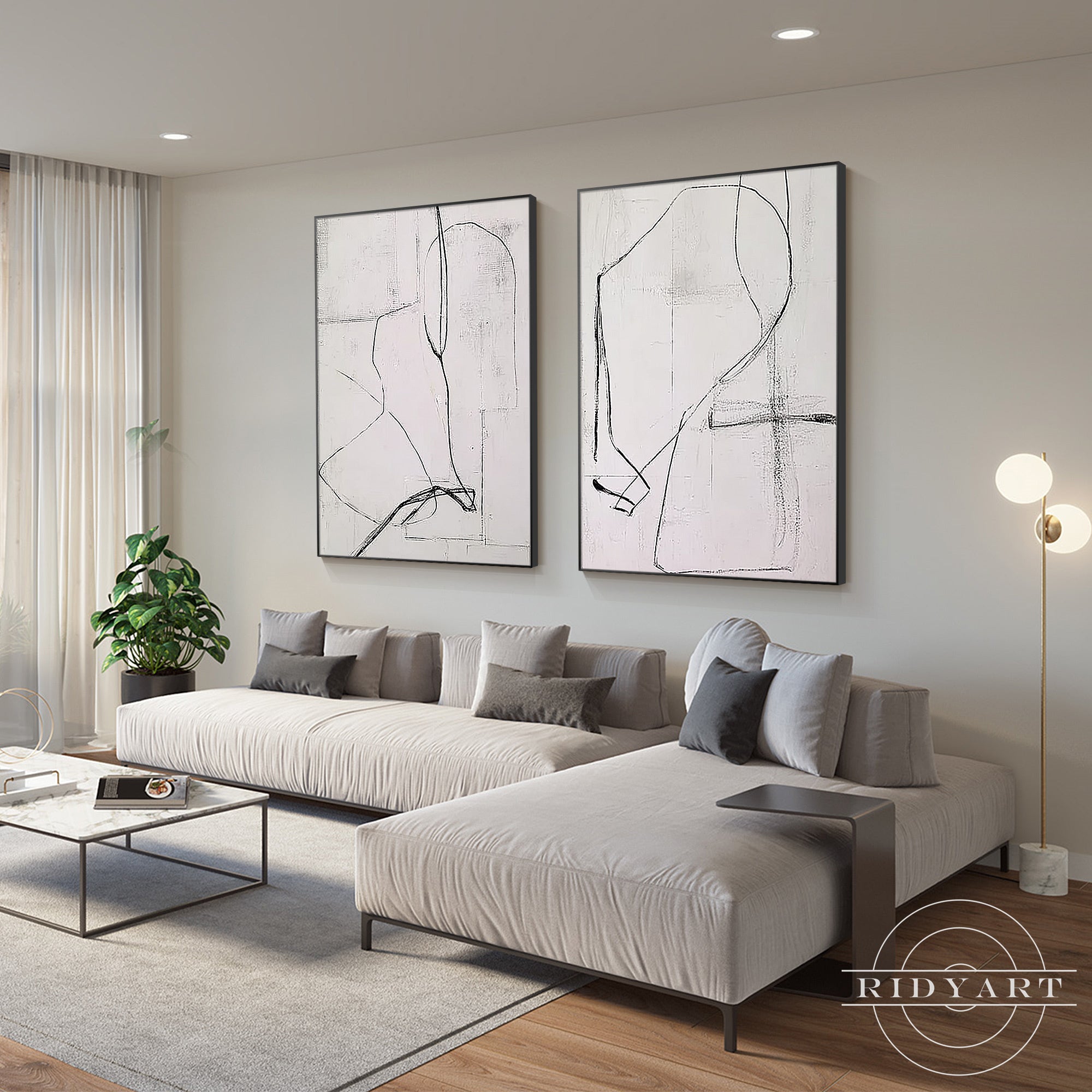 Large neutral abstract artwork set above sofa in modern living space