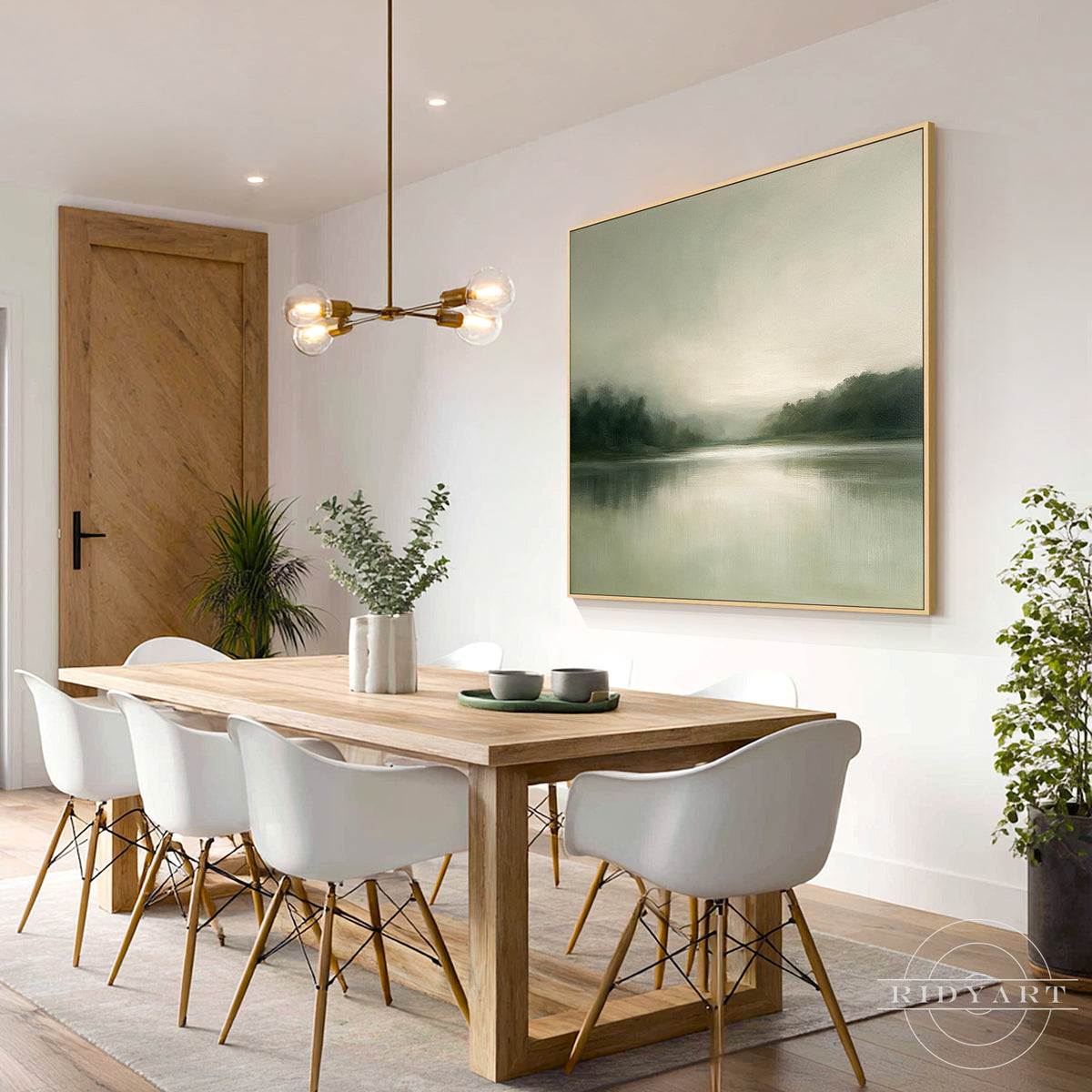 Tranquil sage green misty lake canvas artwork hanging over a plush beige upholstered bed frame in a soothing Scandinavian minimalist bedroom.