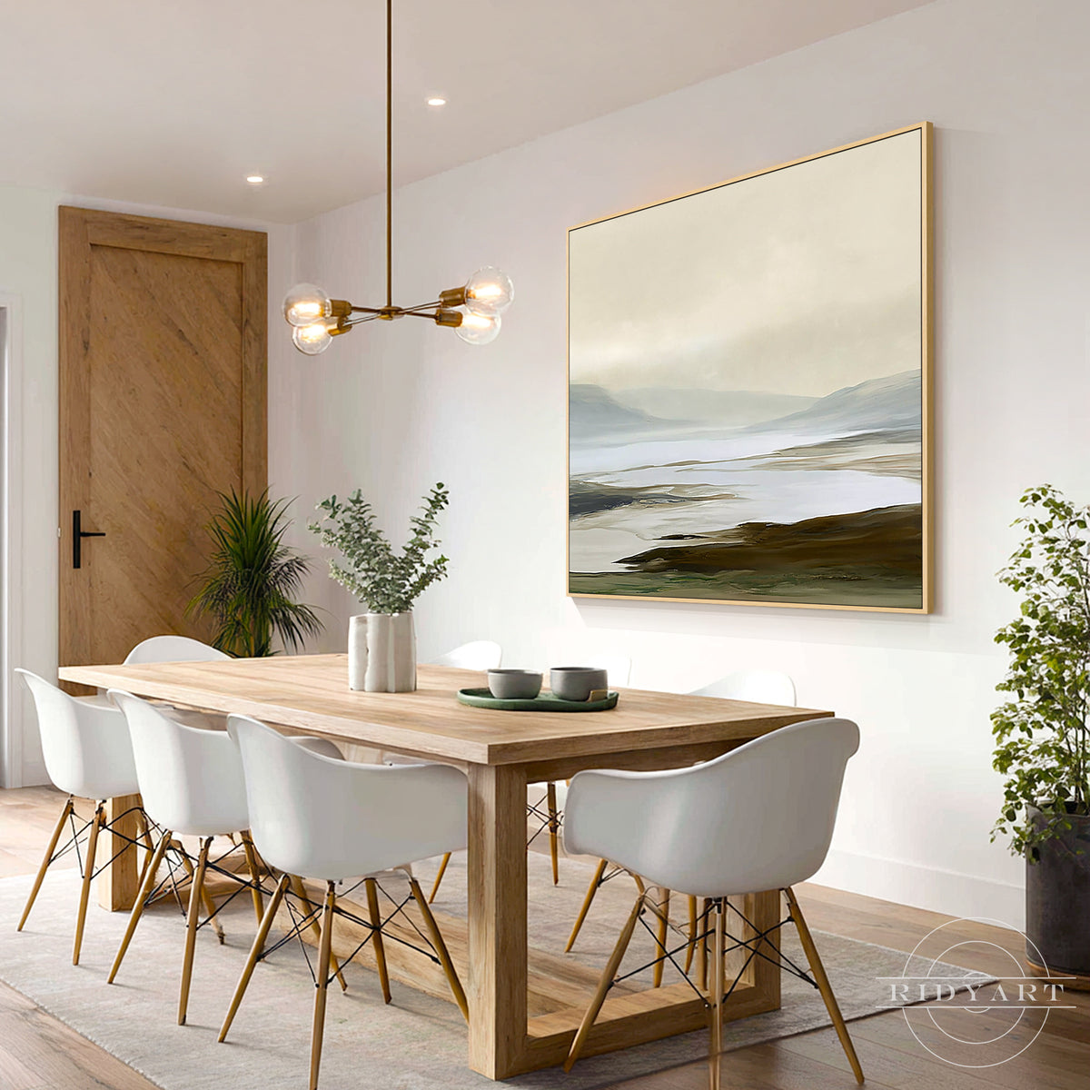 Soothing fog blue and sand beige landscape canvas painting providing a peaceful expansive backdrop above a contemporary wooden dining table.
