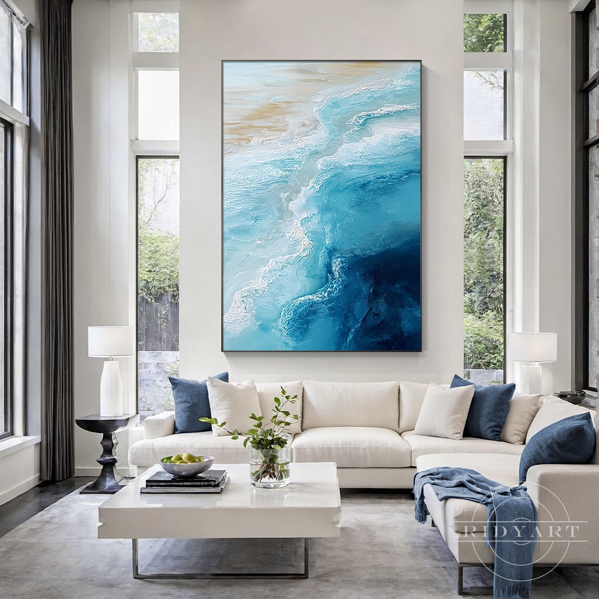 Modern coastal wall art featuring abstract ocean waves in aqua and deep blue
