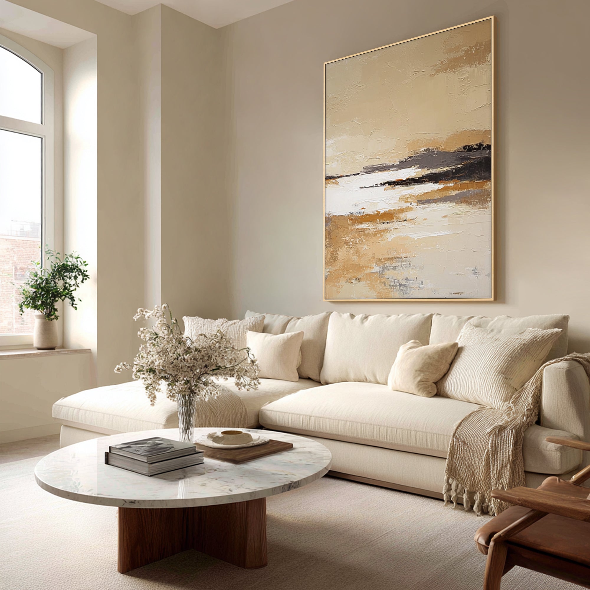 large neutral abstract landscape wall art above sofa in modern living room