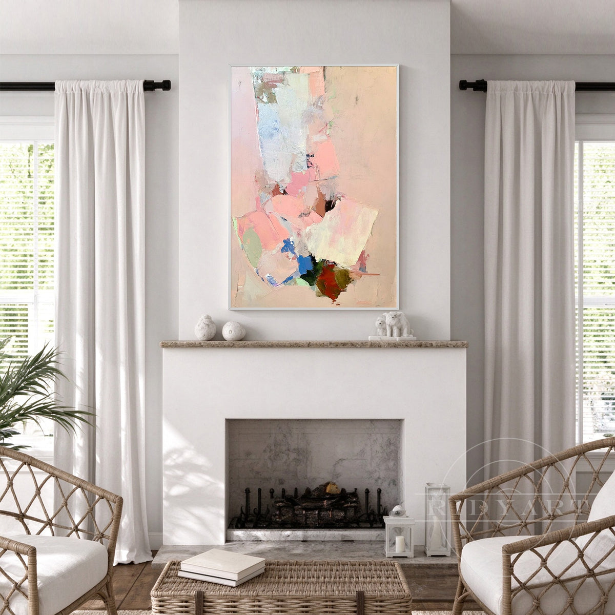 Hand-painted blush pink modern abstract oil painting on canvas above a light grey sofa in a modern living room.