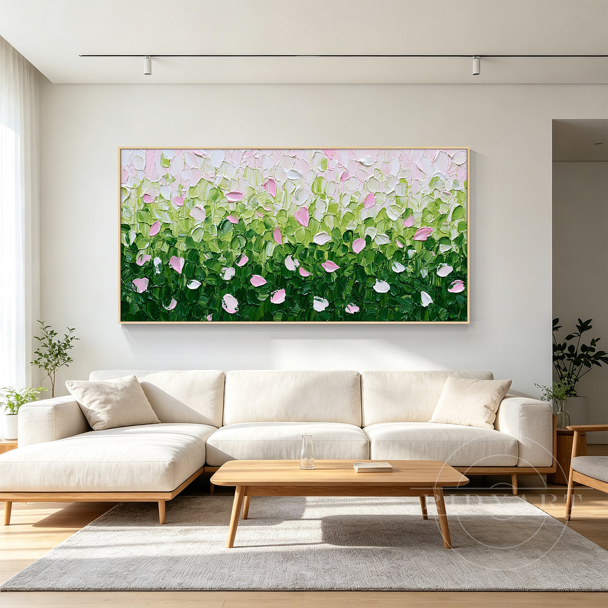 Large botanical painting with deep green leaves, sage foliage and pink petals creating fresh nature-inspired living room decor.