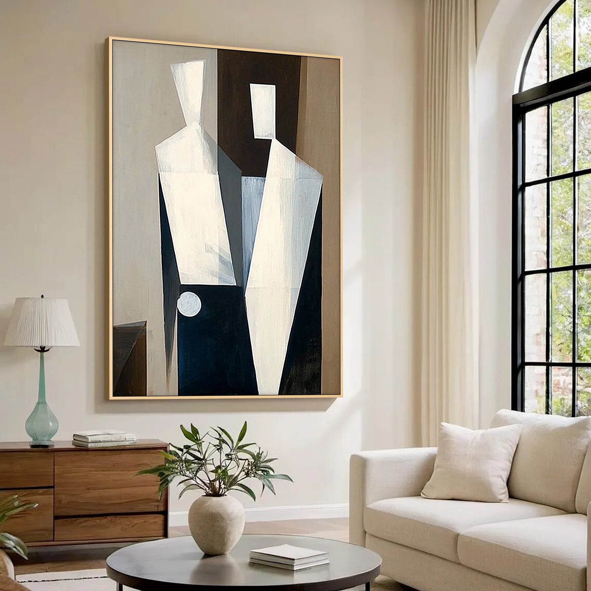 large abstract figure wall art above sofa in modern living room