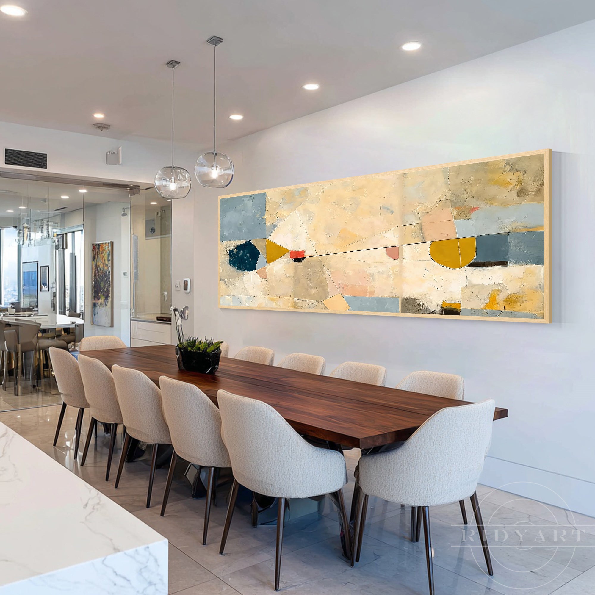 Oversized wide horizontal canvas painting displayed on a dining room wall above a long dark wood table with cream chairs.