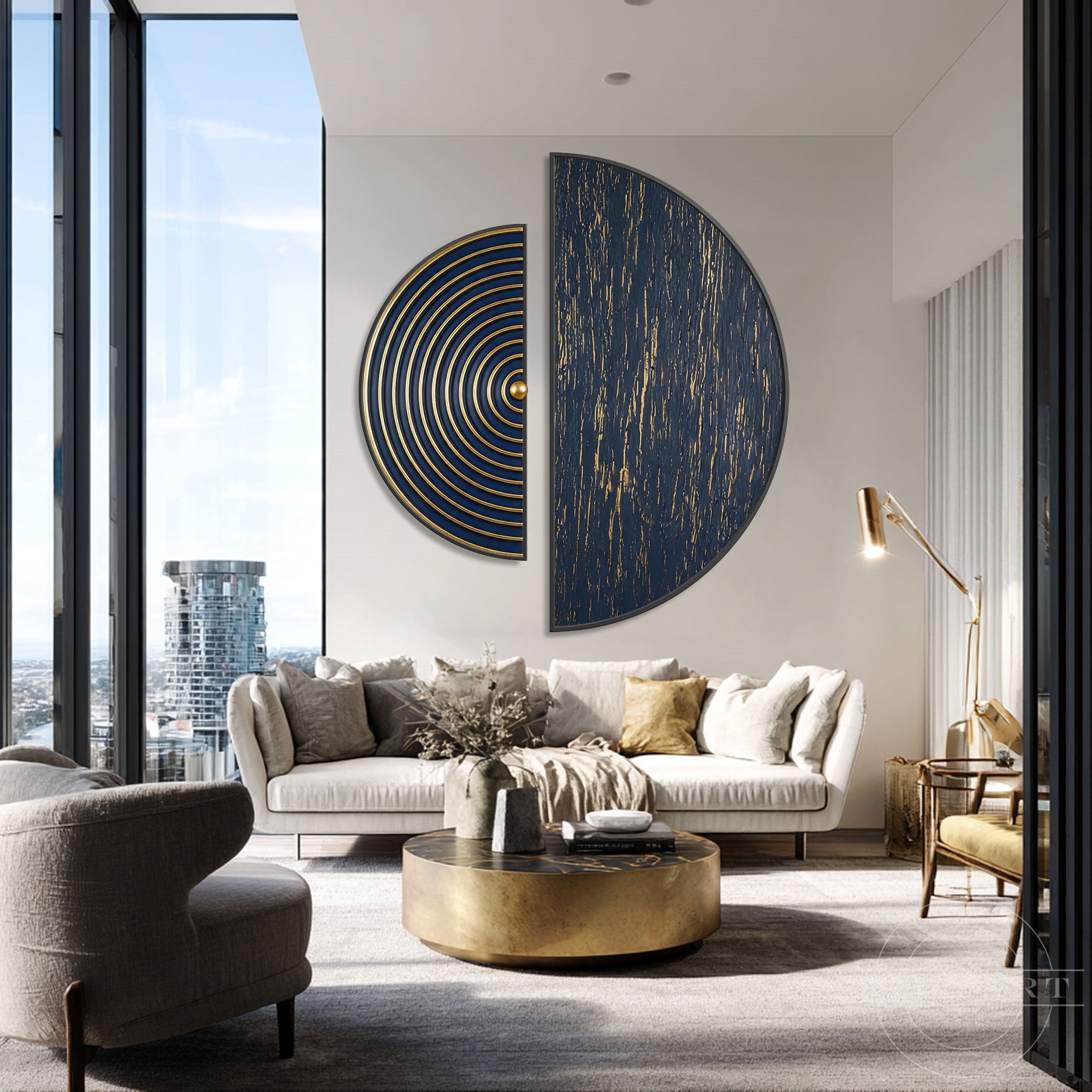 Large blue and gold geometric wall decor styled in a bright, modern living room with a cream-colored sofa and brass coffee table.