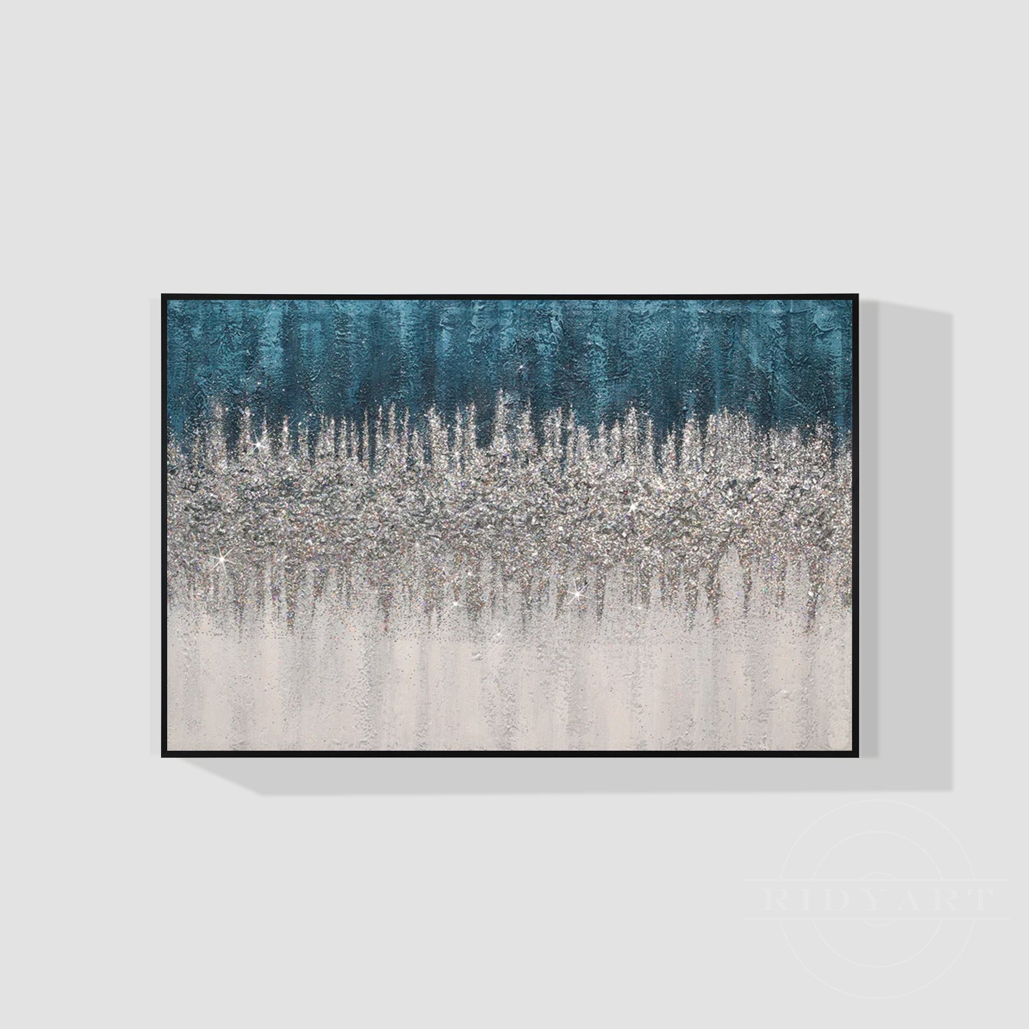 Abstract blue and silver glitter canvas wall art with shimmer accents and modern black frame.