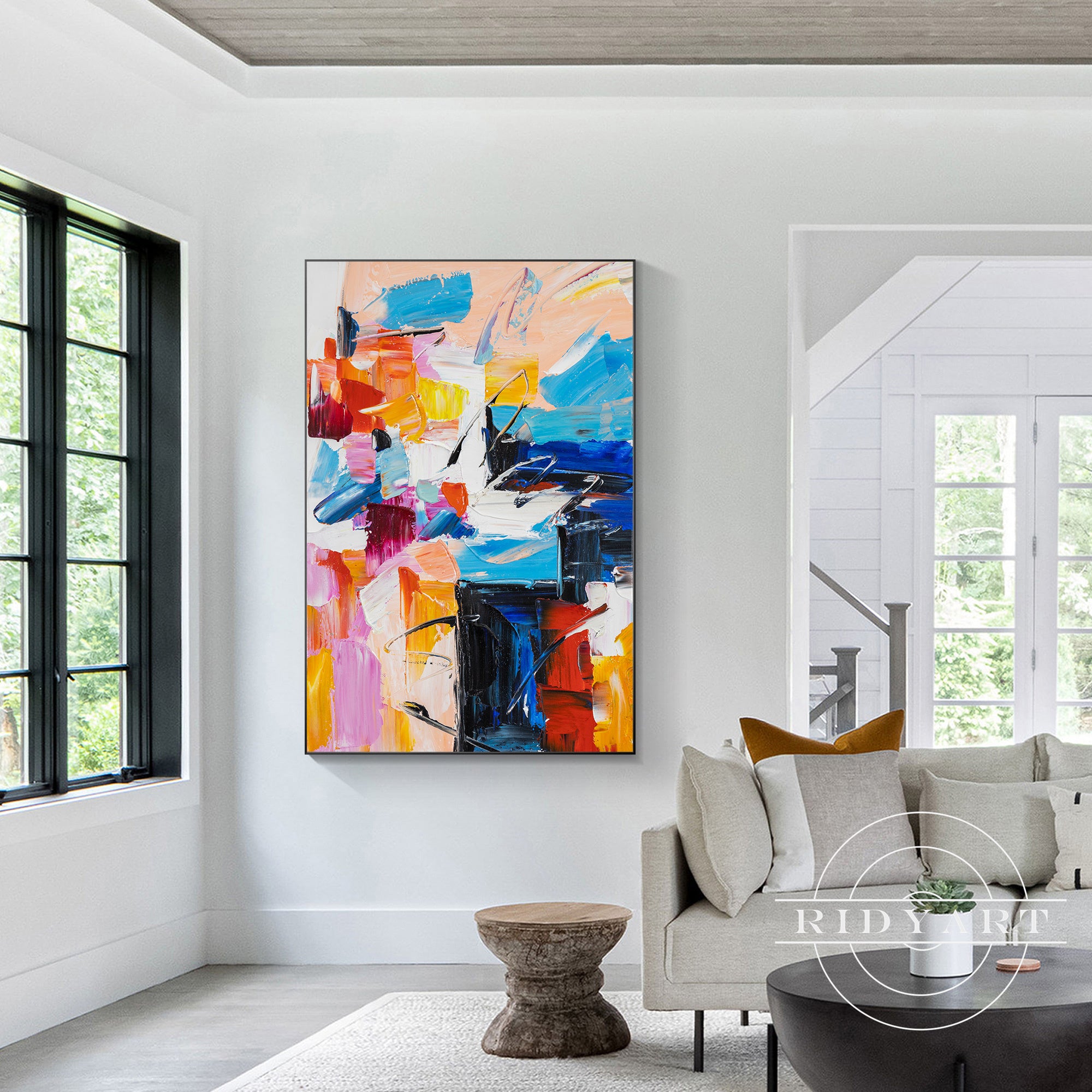 Bold abstract art featuring a mix of orange, blue, and pink hues.