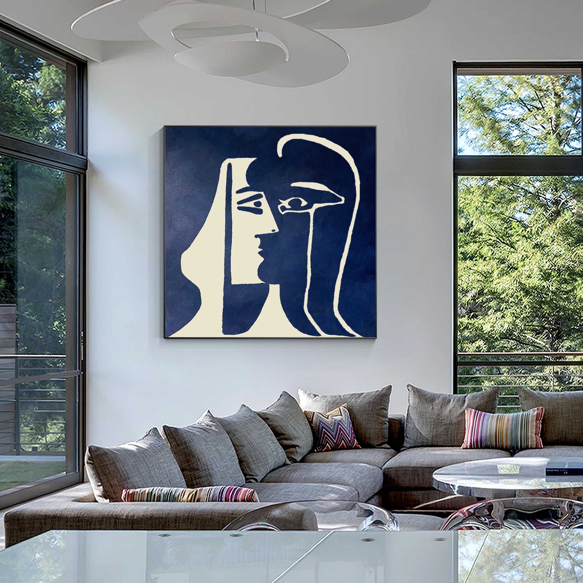 Abstract minimalist wall art featuring dual faces in navy and cream tone