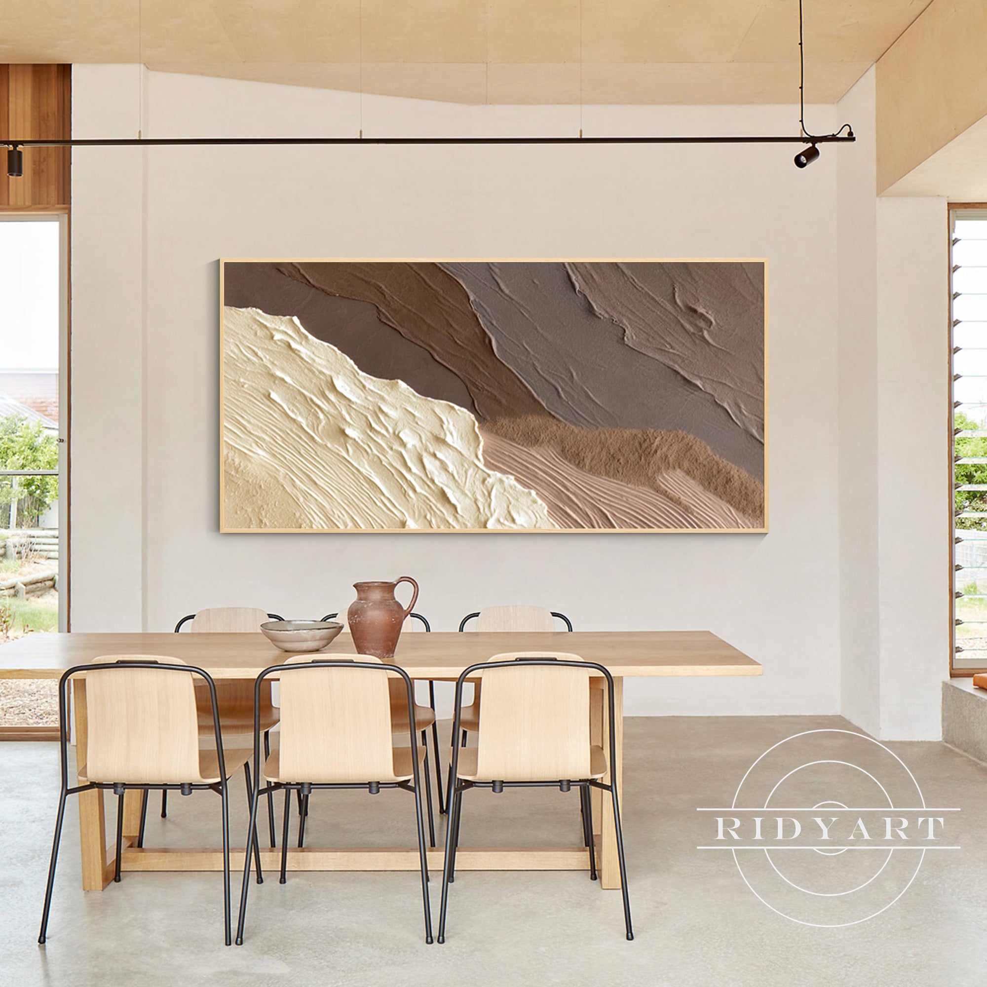 Coastal wall decor featuring neutral wave painting on canvas
